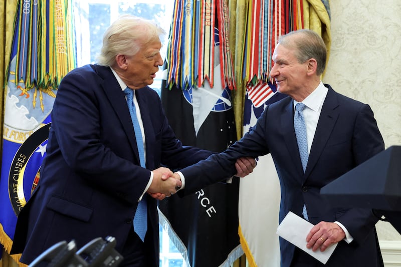 Donald Trump (L) and Paul Atkins (R)