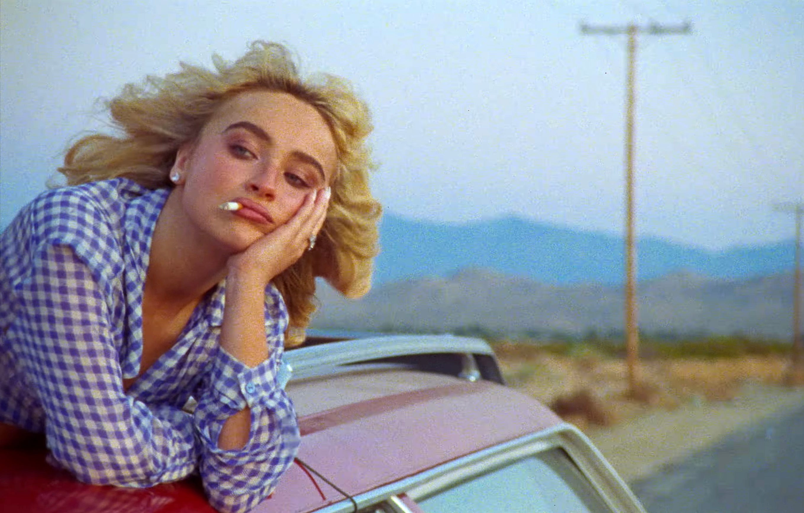Sabrina Carpenter in the "Manchild" music video.