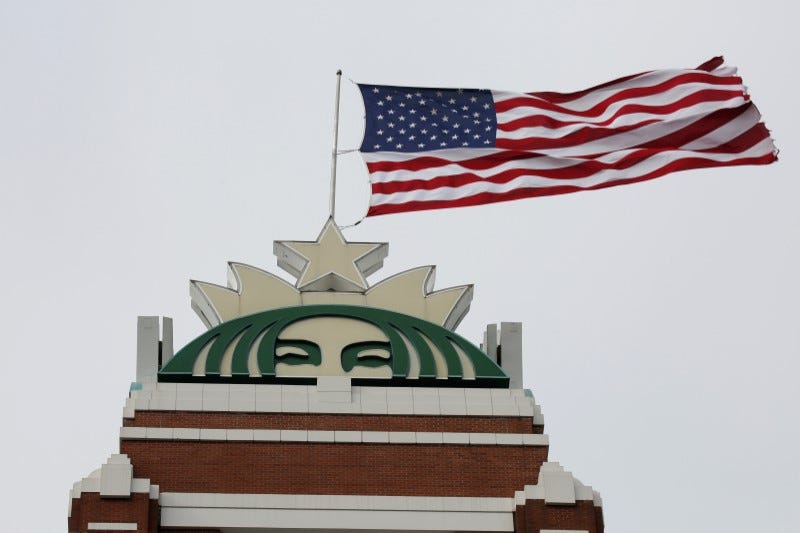 FILE PHOTO: A flag flies above the company's headquarters as Starbucks Corp opens the first upscale Starbucks Reserve store at the Starbucks headquarters in Seattle, Washington, U.S., February 27, 2018. REUTERS/David Ryder