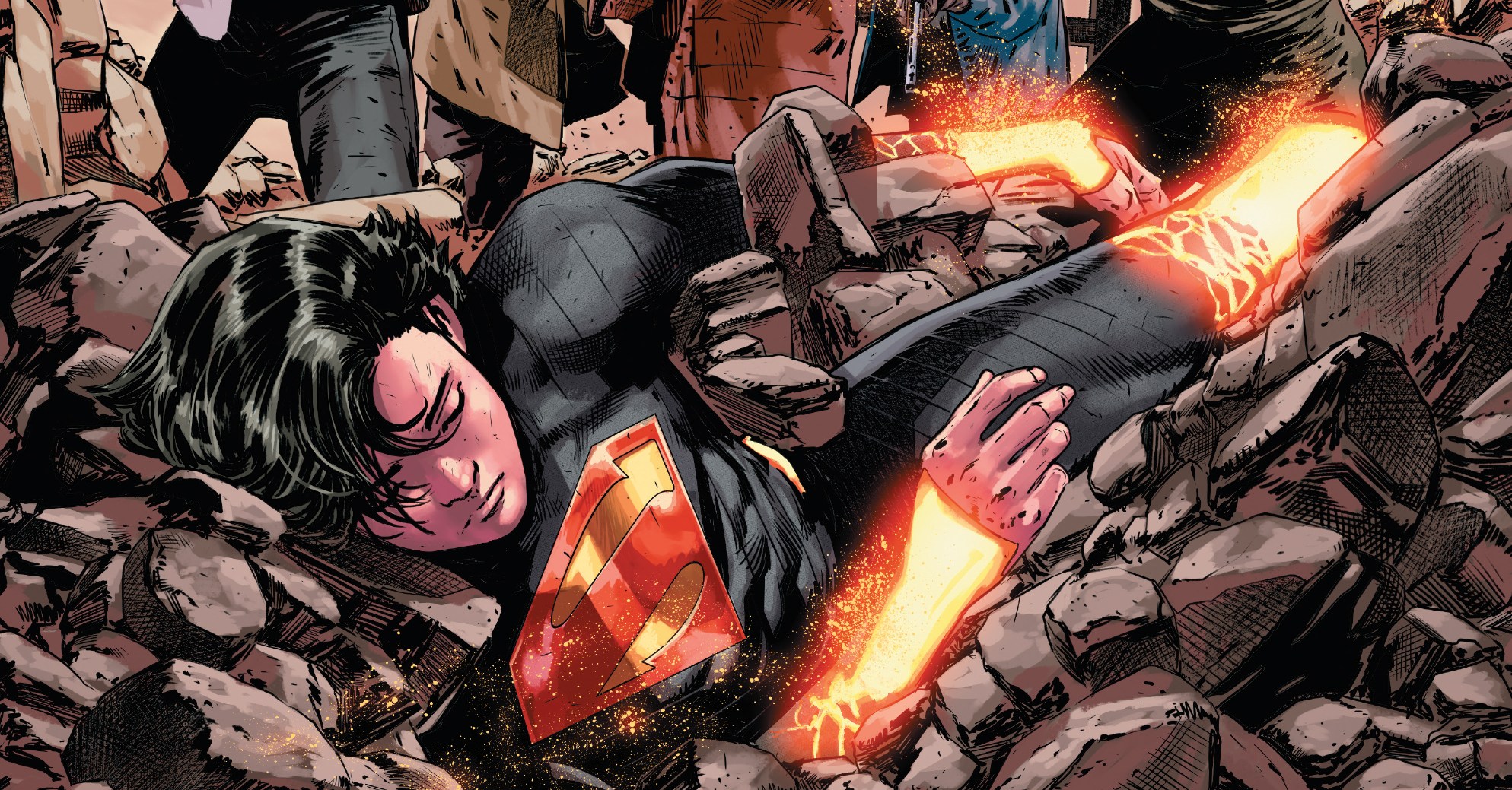 The cover of Absolute Superman #6 shows Kal-El seemingly unconscious and buried in rubble, surrounded by men with guns in front of a “Welcome to Smallville” sign