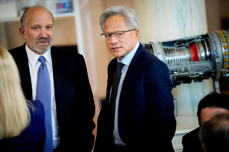 Jensen Huang speaks to Howard Lutnick at a White House event dedicated to investing in the U.S.
