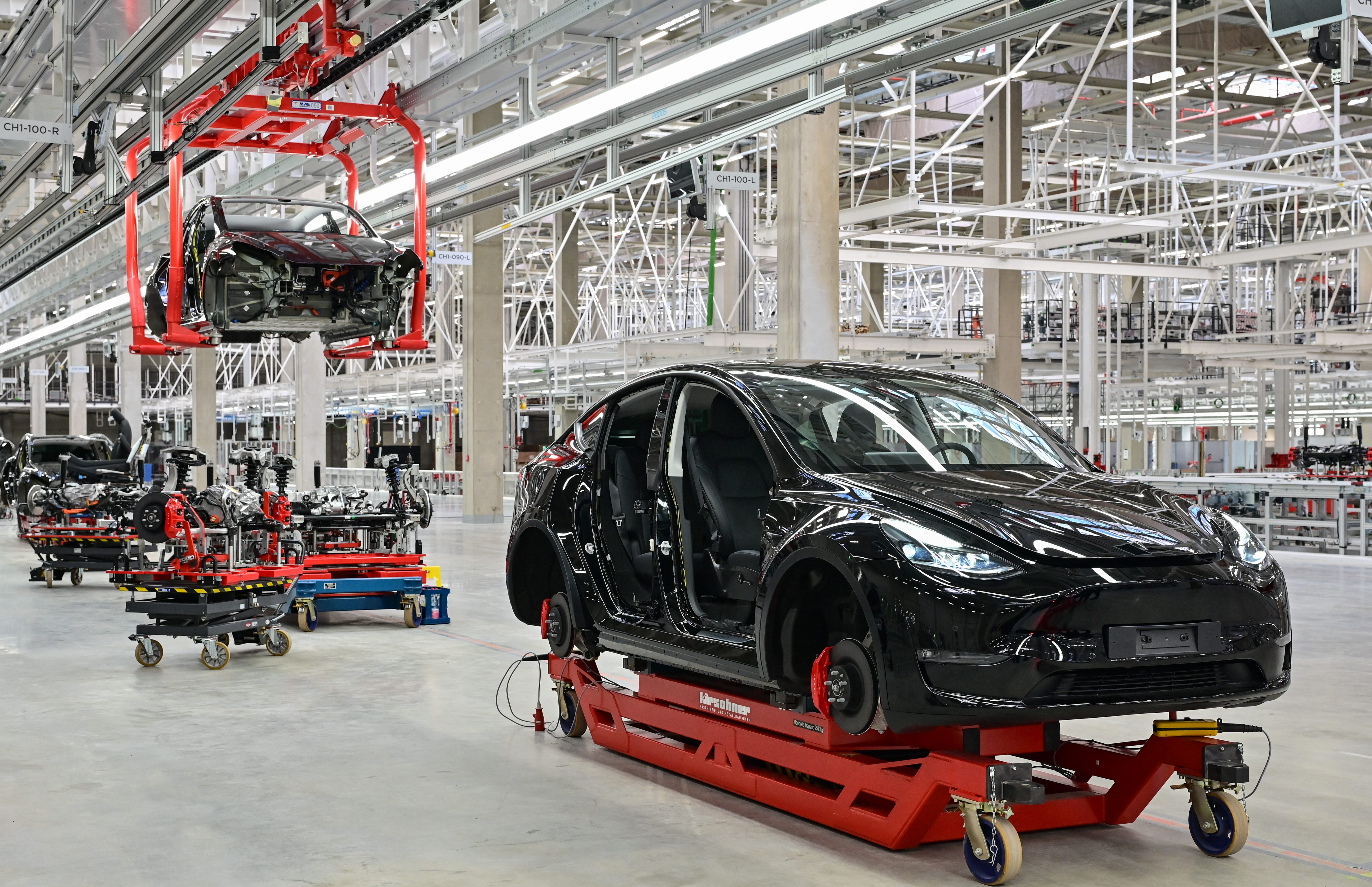A Tesla Model Y under construction stands in a production hall of the Tesla Gigafactory during the open day in Grünheide, east of Berlin.