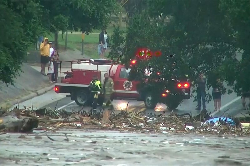 First responders survey rising flood waters of the Guadalupe River after flash flooding in Kerr County, Texas, U.S. July 4, 2025