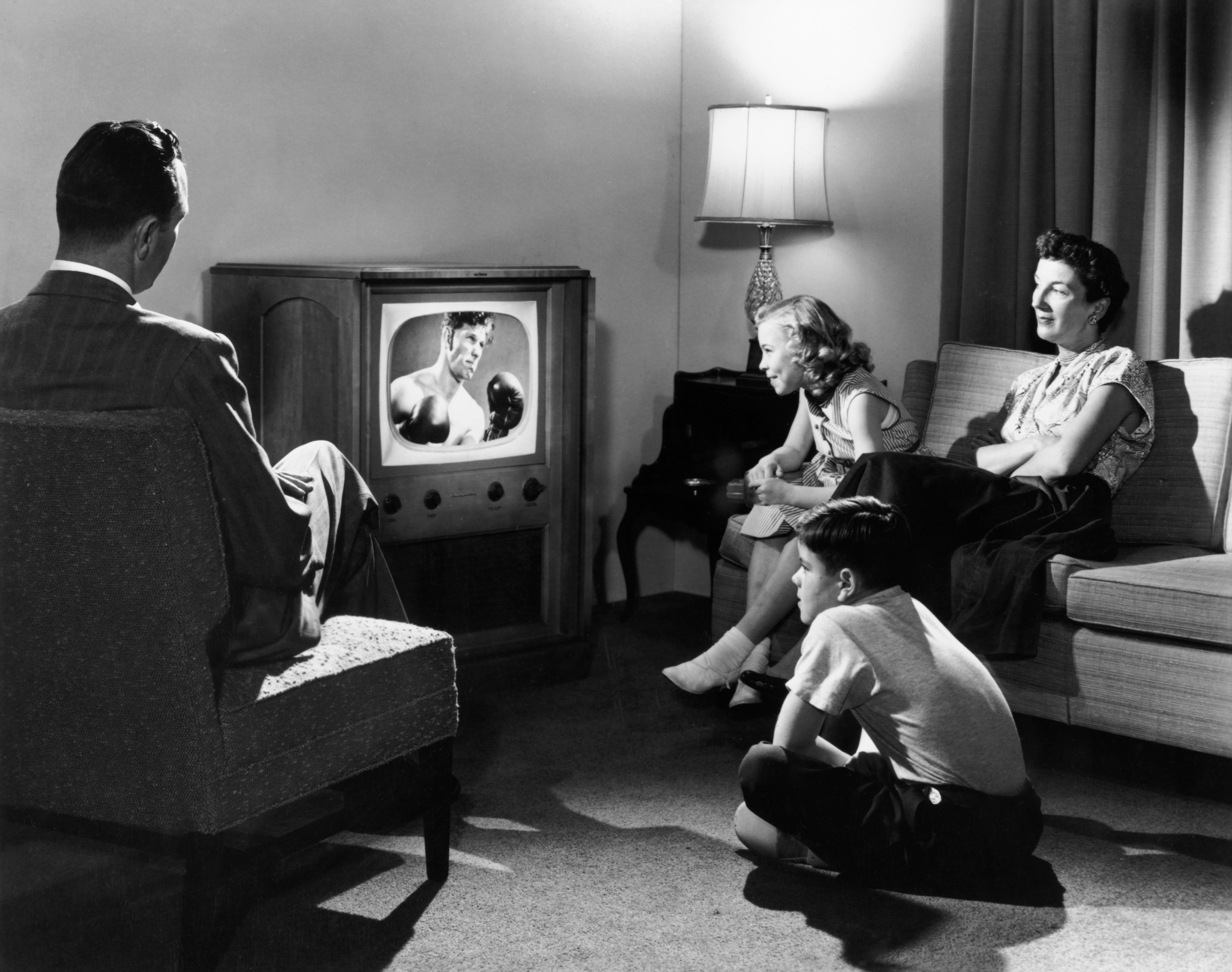 A family watching TV in the 1950s
