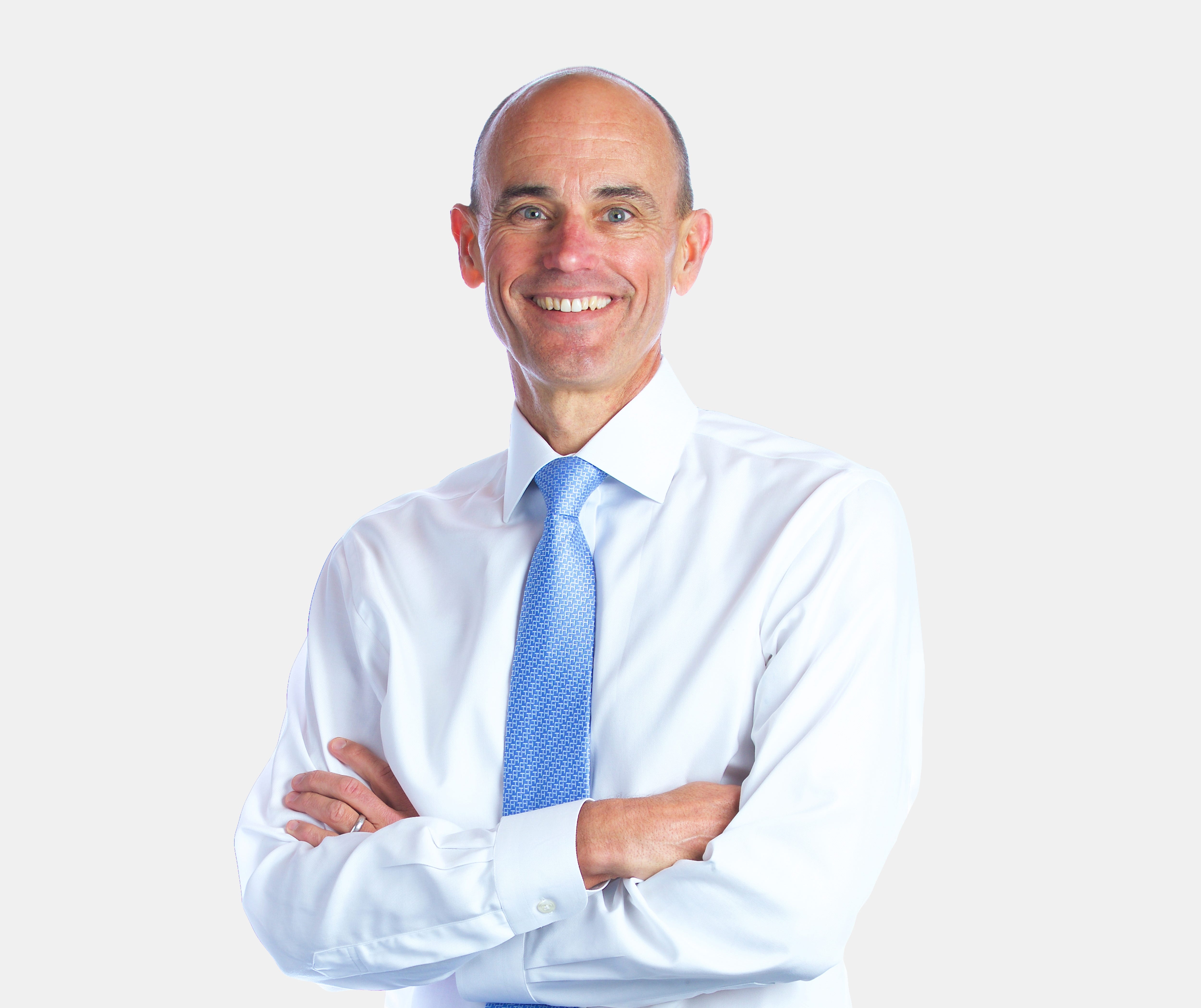 Bob Sternfels in white shirt and blue tie