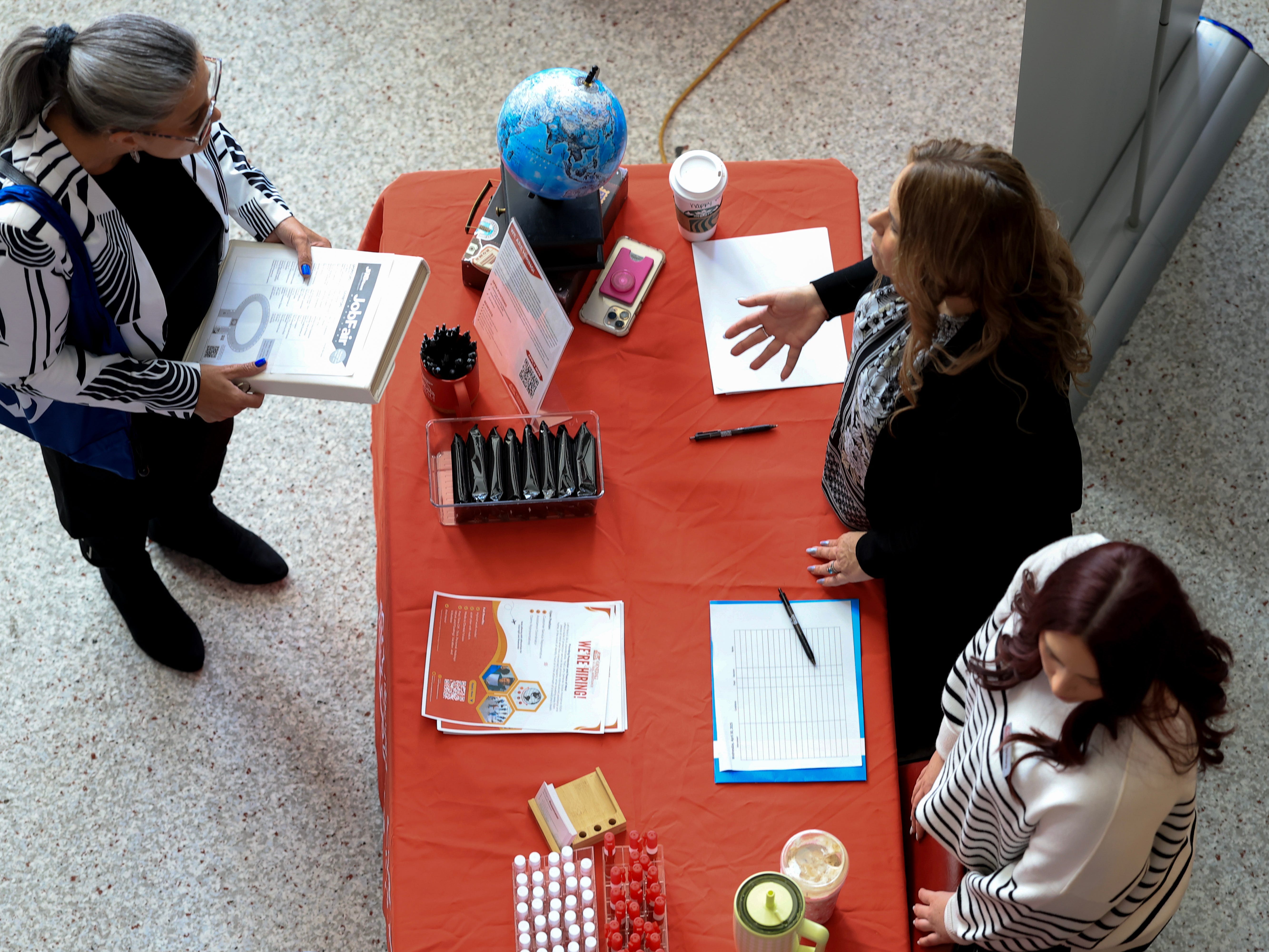 Three people at a job fair