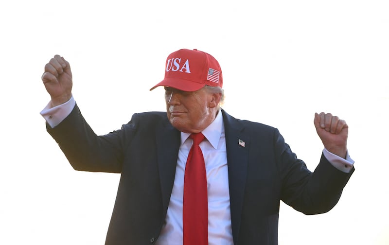President Donald Trump dances as he leaves the stage after speaking at the Salute to America Celebration at the Iowa State Fairgrounds in Des Moines
