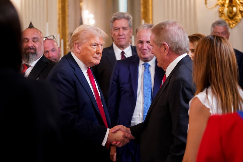 President Donald Trump shook hands with luncheon attendees after delivering a meandering speech.