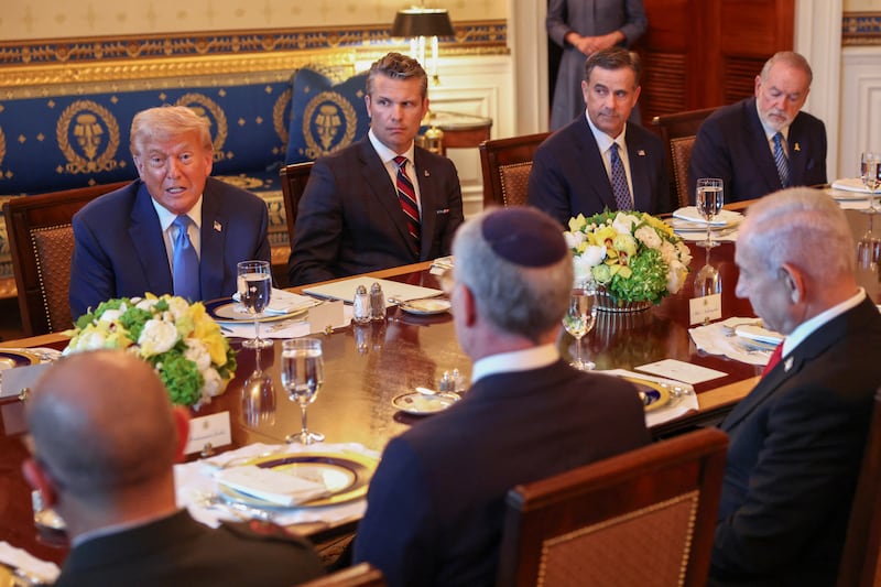 Defense Secretary Pete Hegseth looks on during a dinner at the White House on Monday where President Donald Trump said the U.S. would send more weapons to Ukraine despite the Pentagon putting a freeze on weapons shipments to Kyiv.