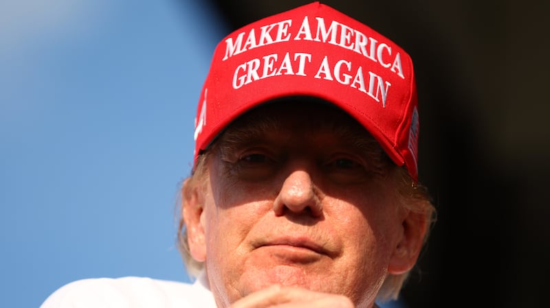 Donald Trump wearing MAGA hat.