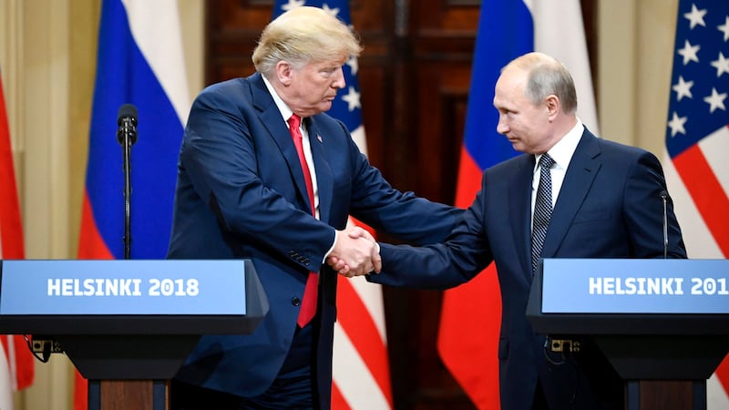 Donald Trump shakes hands with Vladimir Putin during a joint press conference in Helsinki, Finland, on July 16, 2018.