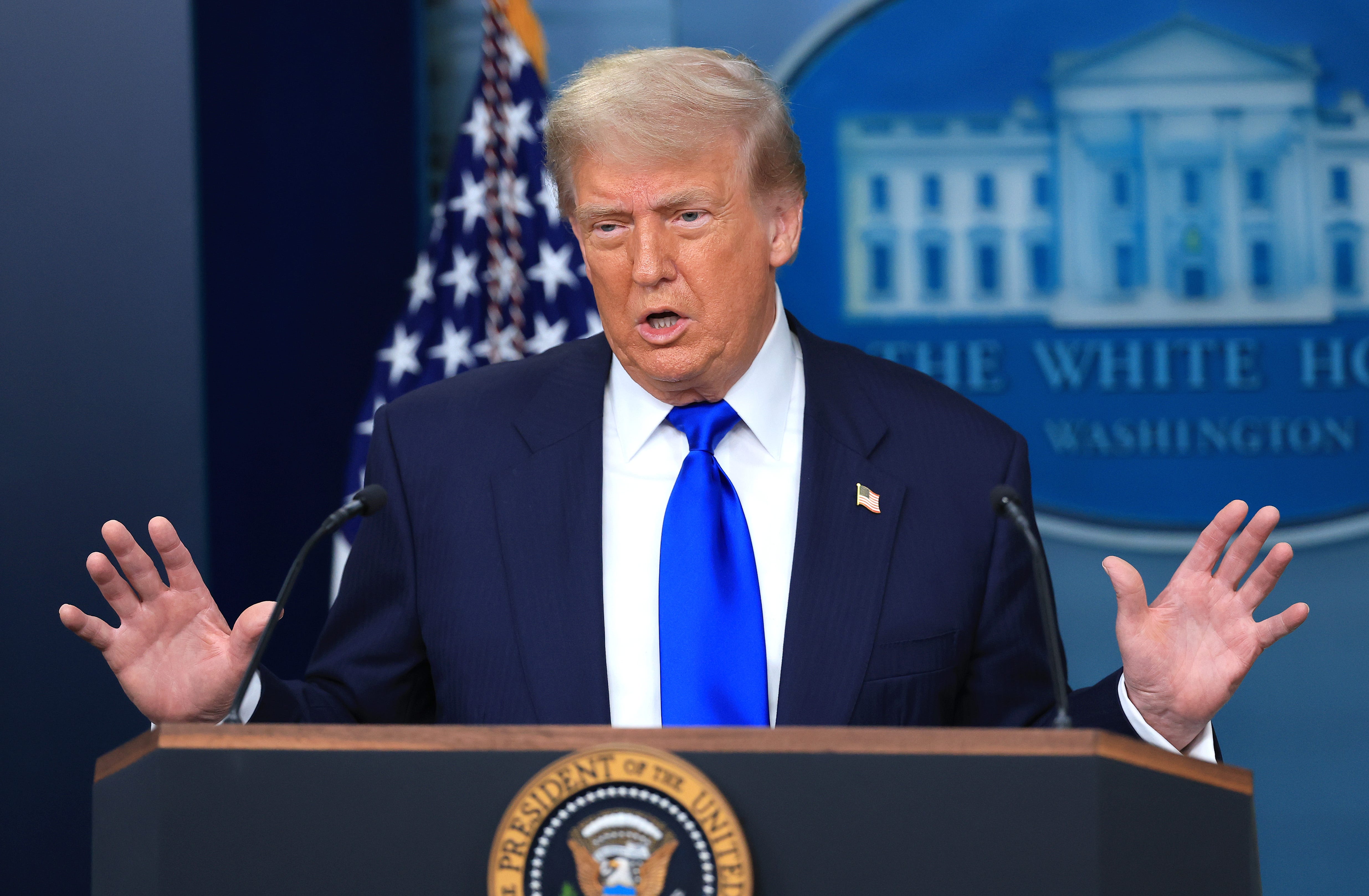 President Donald Trump speaking to reporters at a the White House.