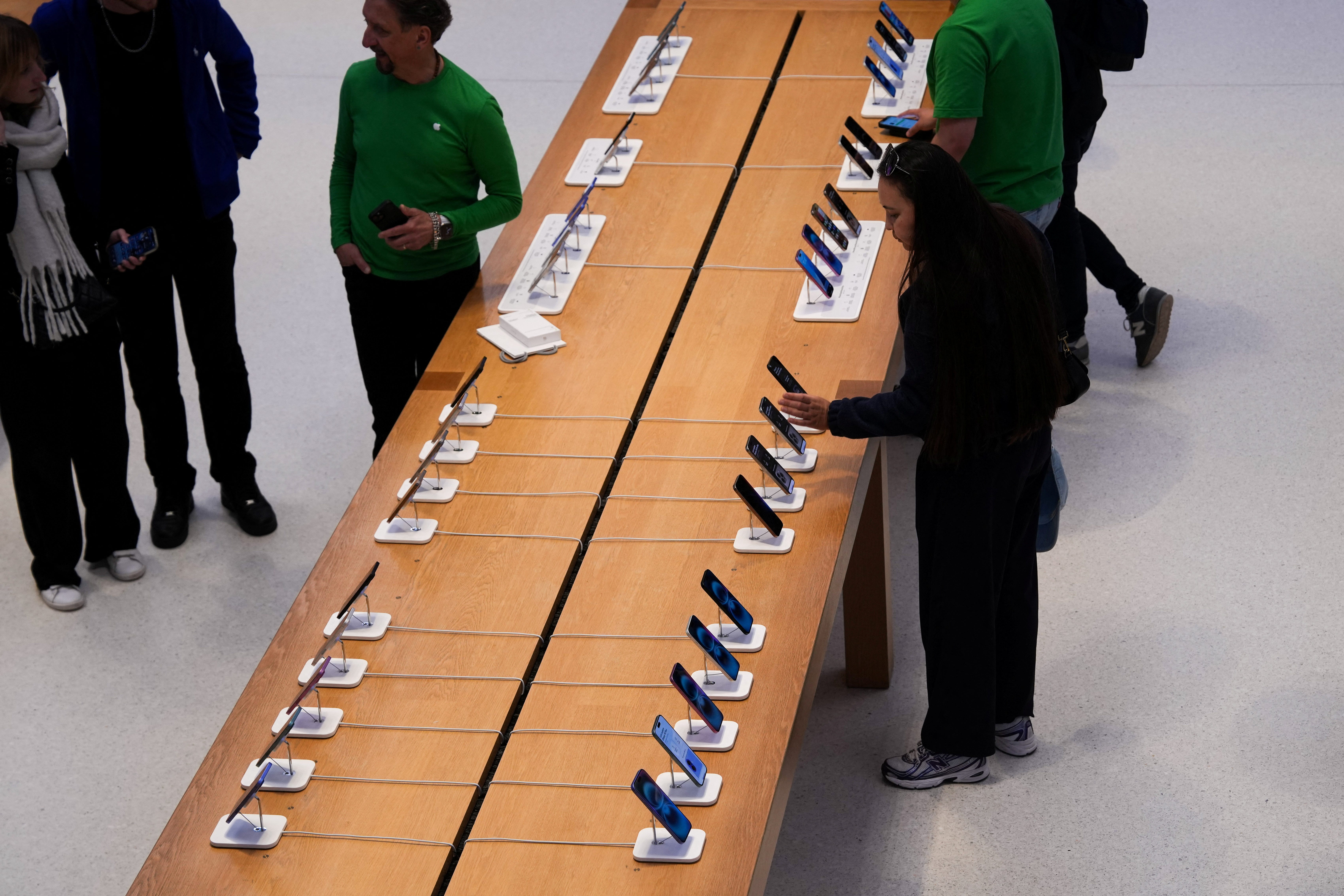 iPhones on display in an Apple Store