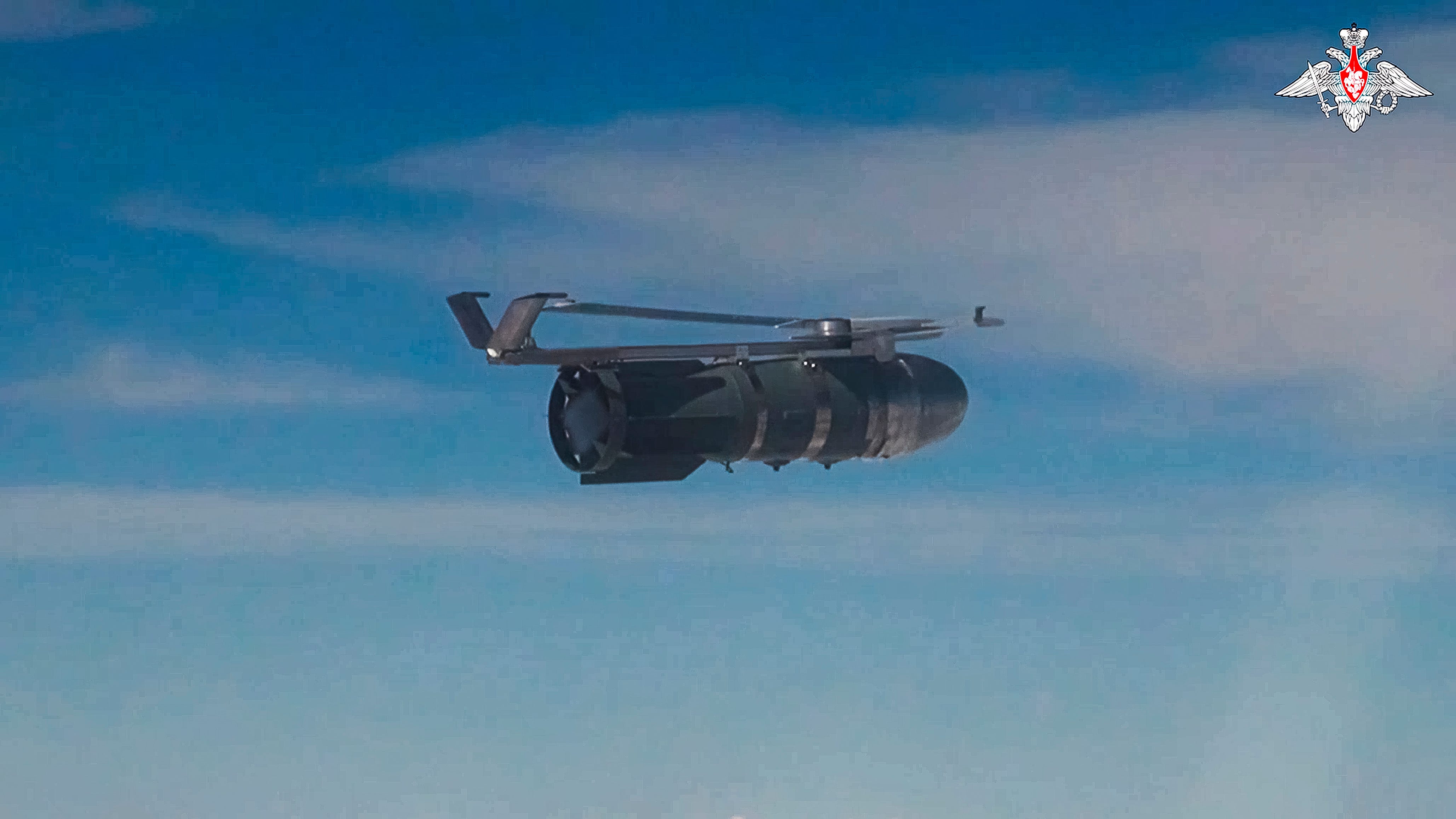 In this photo taken from video released by the Russian Defense Ministry on Friday, Aug. 9, 2024, A glide bomb is dropped by a Russian warplane to strike Ukrainian positions in Ukraine's Sumy region that borders Russia's Kursk region.