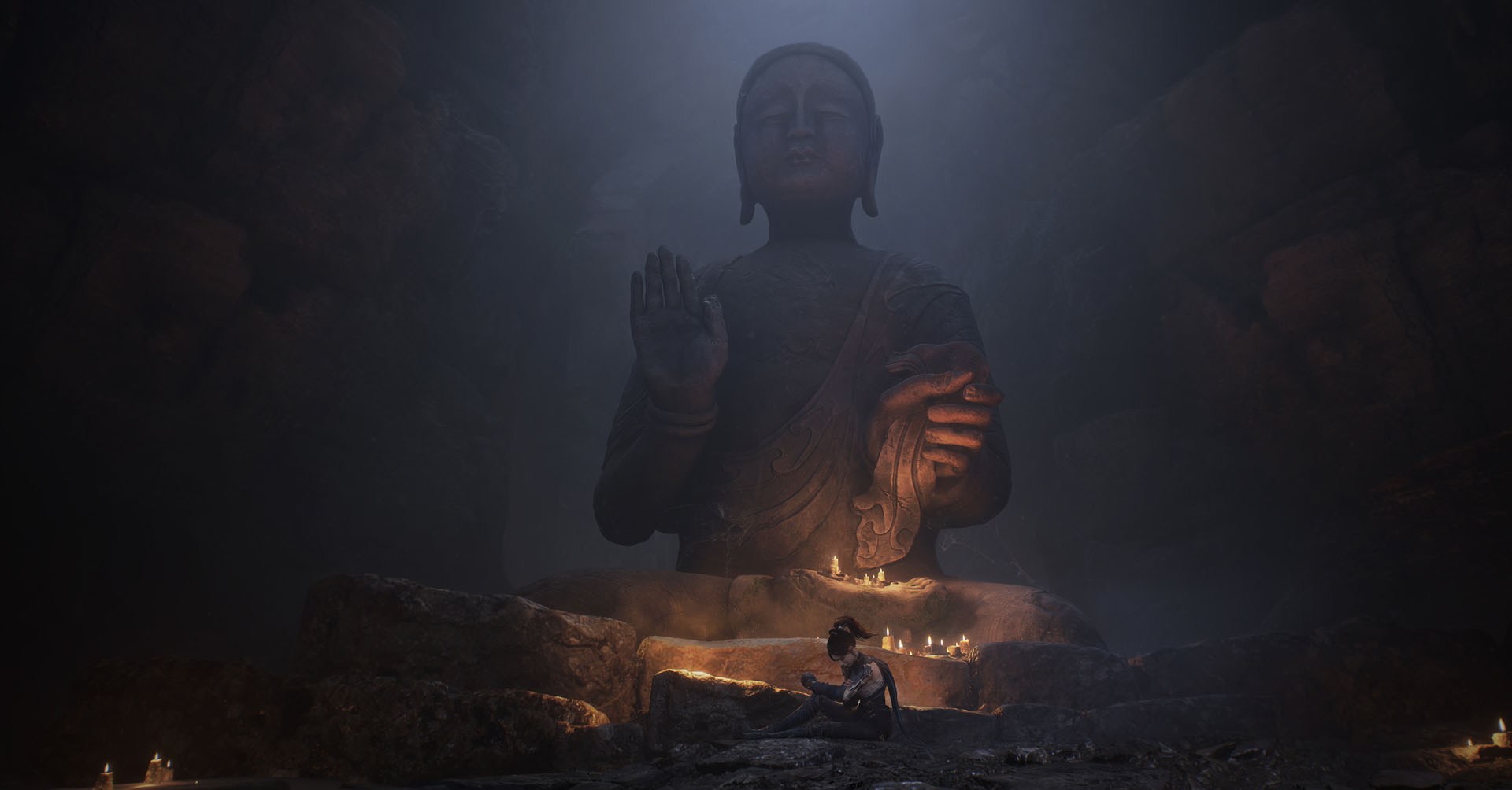 A Wuchang: Fallen Feathers screenshot showing the main character sit in front of a large Buddha statue.