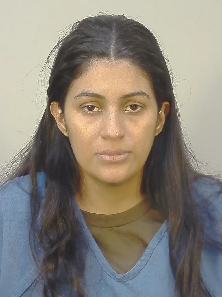 Mugshot of a woman with long dark hair.