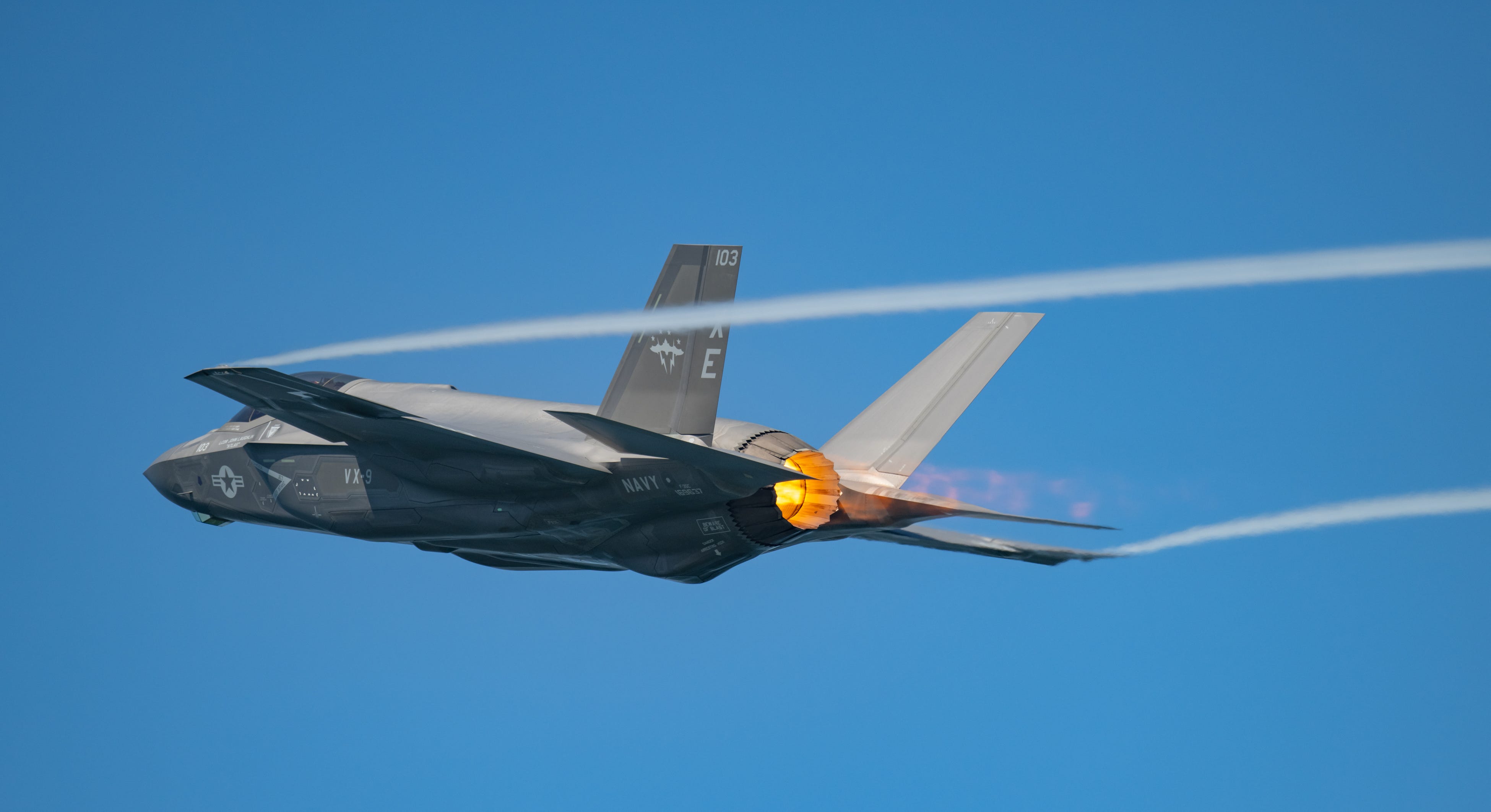 An F-35C from the US Navy's Air Test and Evaluation Squadron Nine (VX-9) engages its afterburner as it climbs from Naval Base Ventura County Point Mugu in Southern California on its way to a training exercise over the adjacent Point Mugu Sea Range on Aug. 18, 2023.