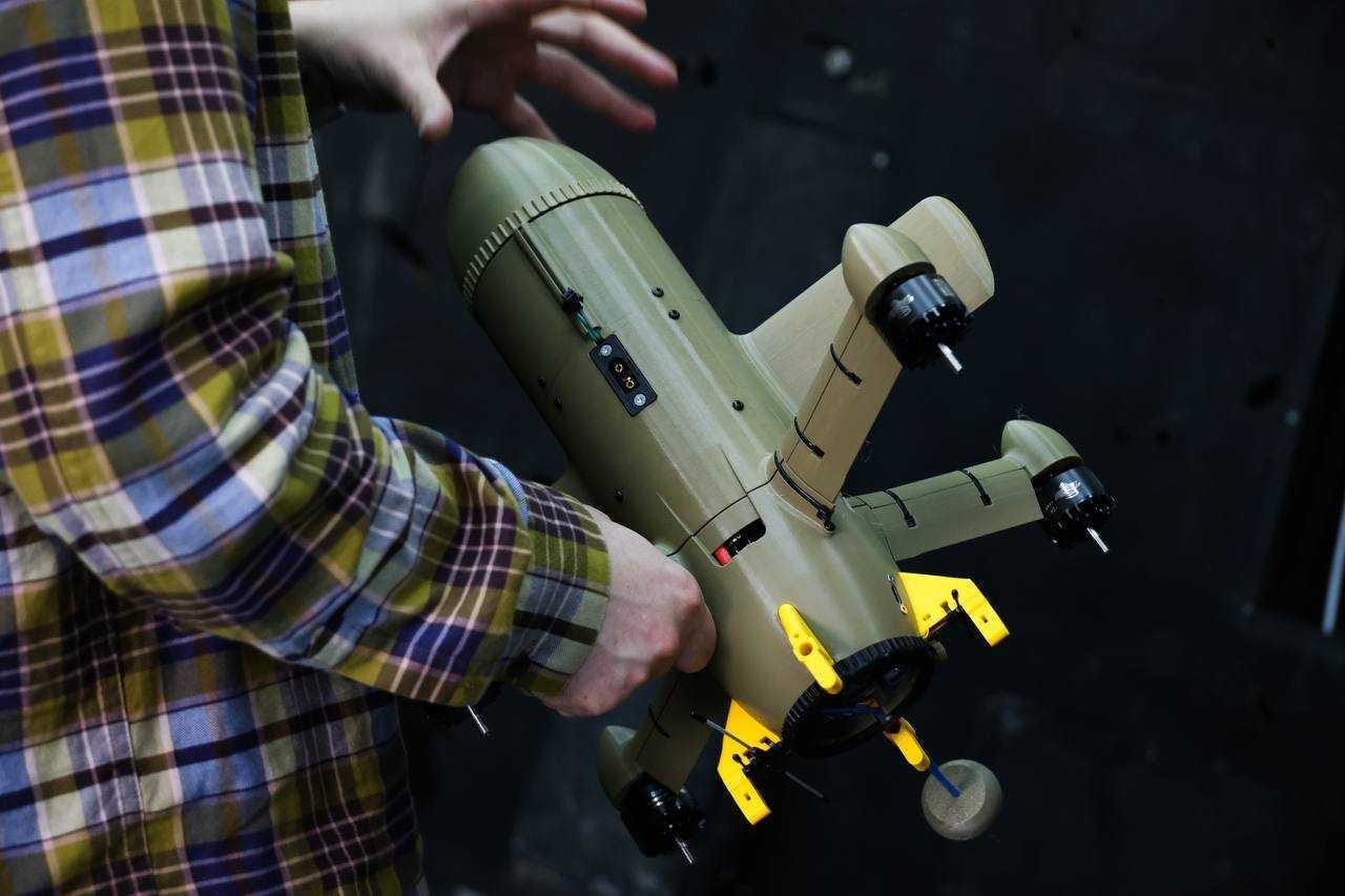 A Ukrainian holds the Sting, an interceptor drone created by the Wild Hornets.