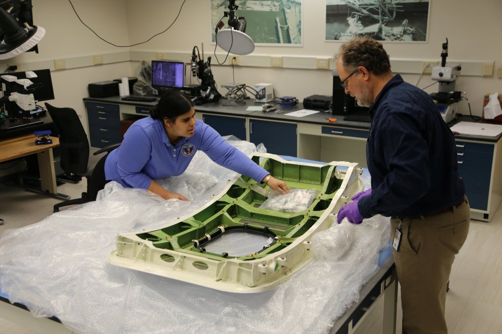 NTSB scientists examine the door plug that blew off the flight 1282 on Jan. 14, 2024.