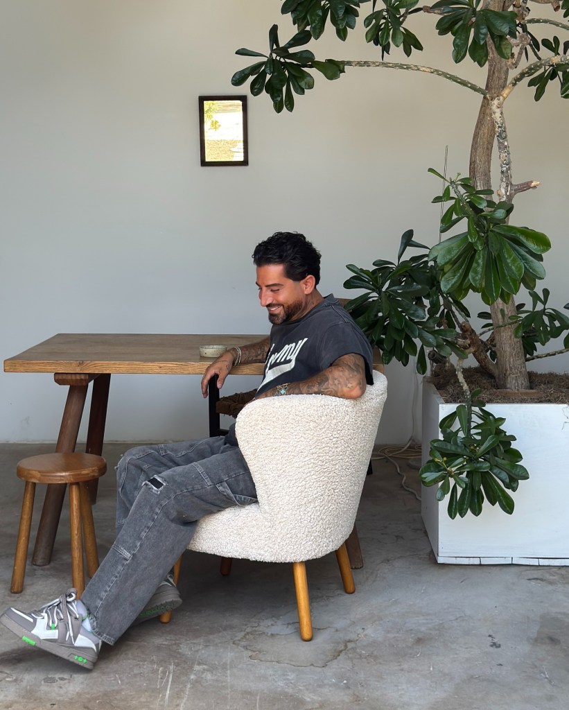 Ryan Pearl sitting in a chair.