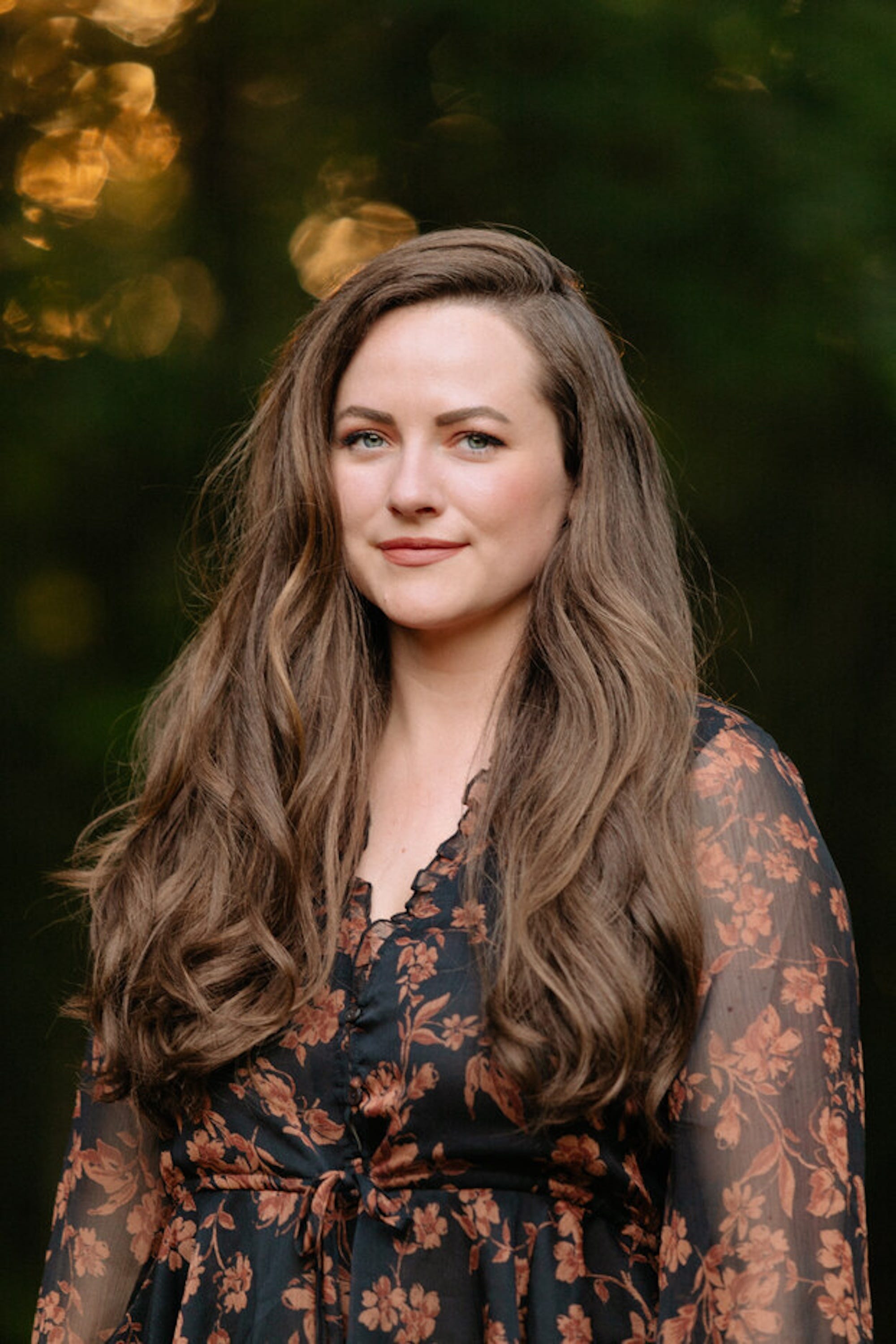 A headshot of Rebecca Ross.