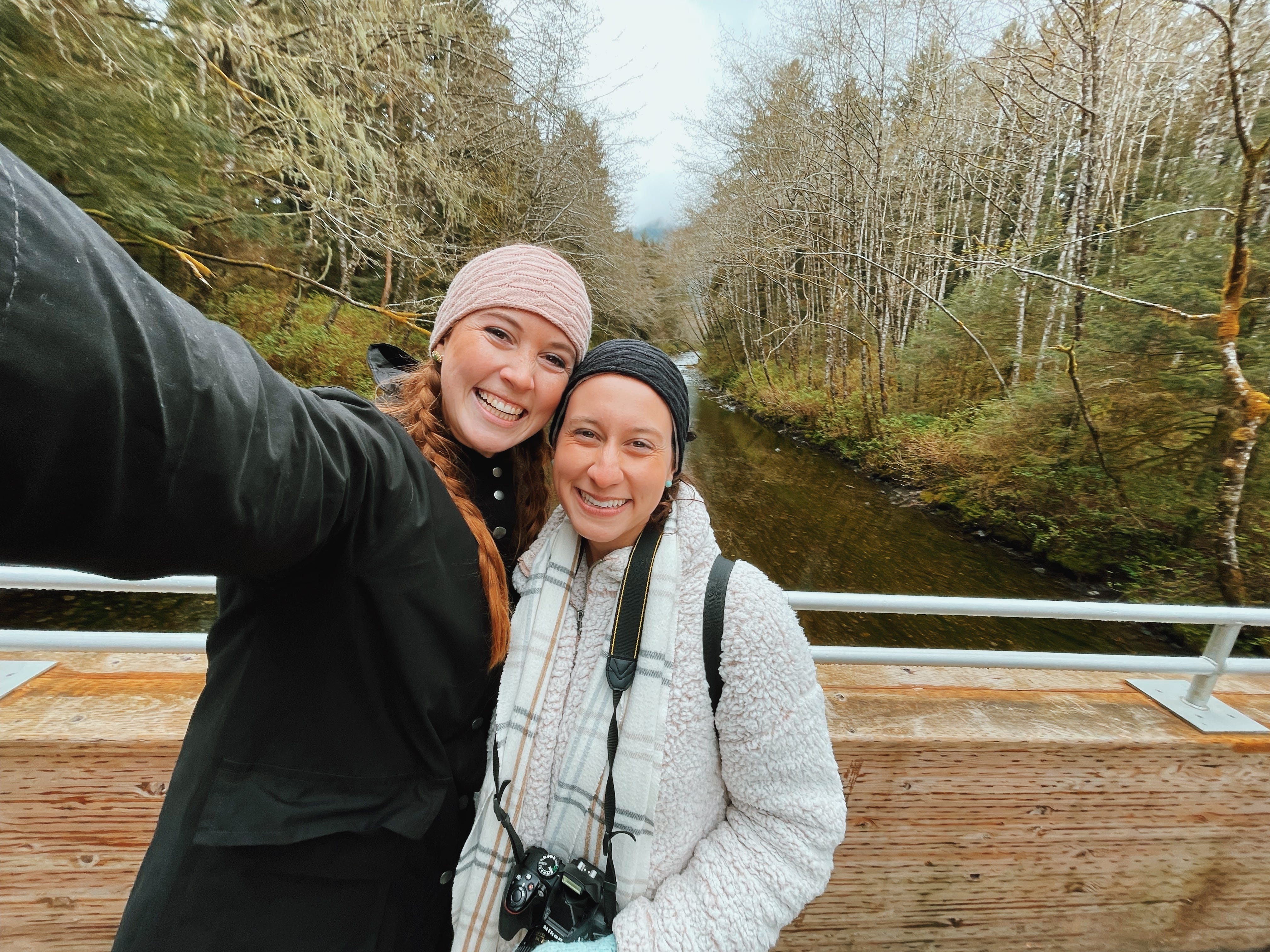 Allie Hubers smiling with friend on bridge