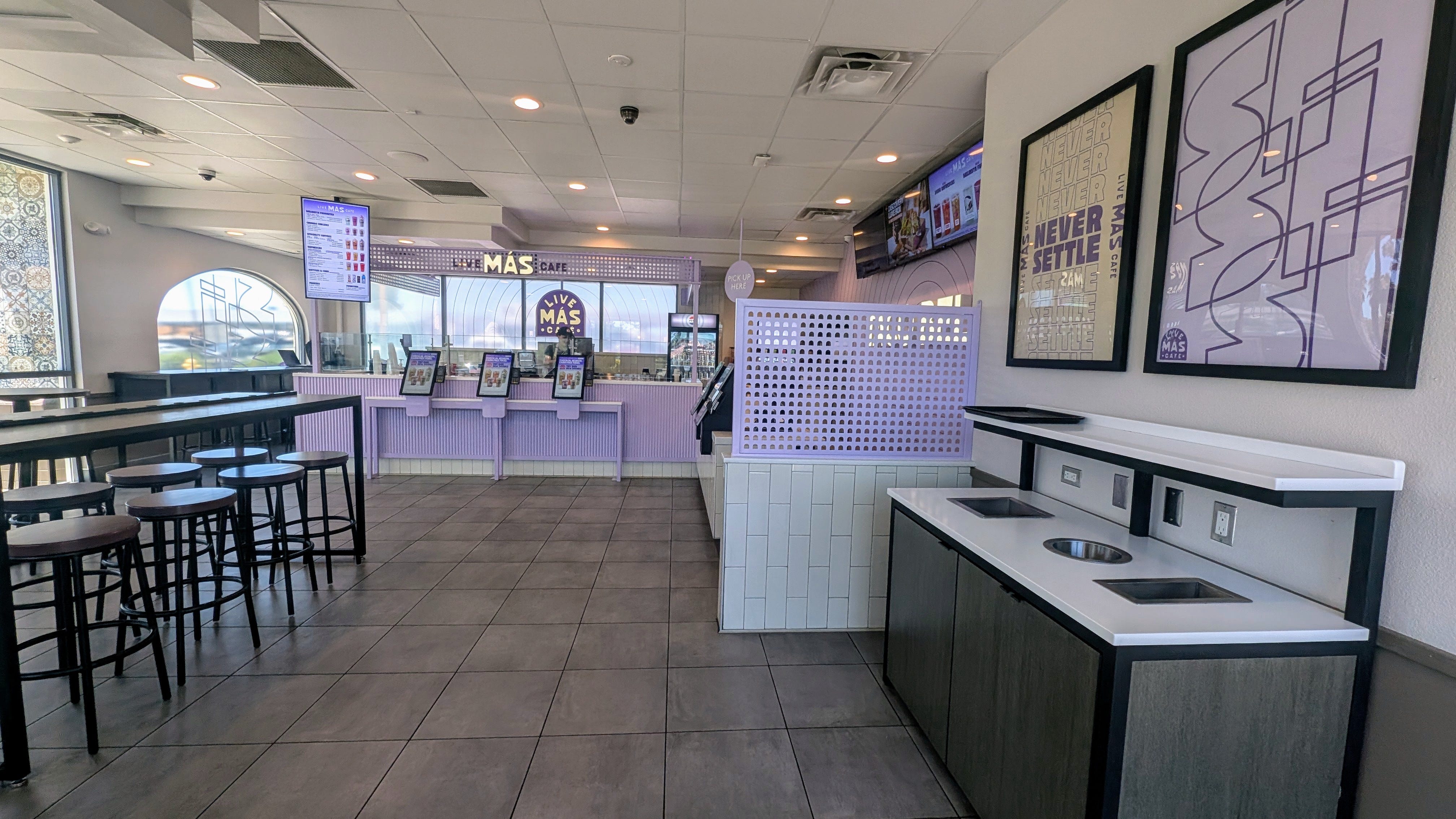 Light purple area with ordering kiosks in Taco Bell Live Mas Cafe