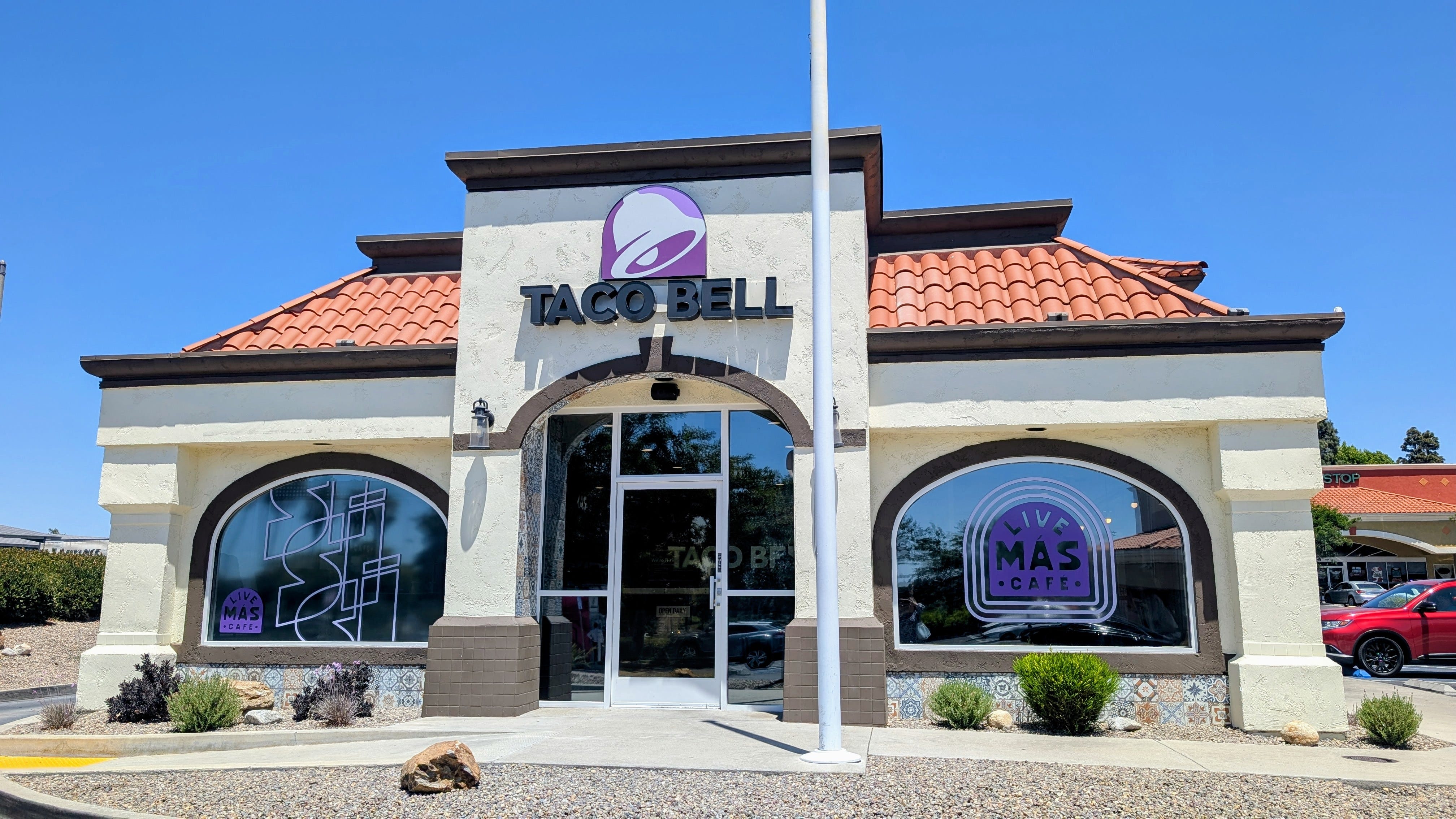 Taco Bell Live Mas location exterior - white building, red roof,