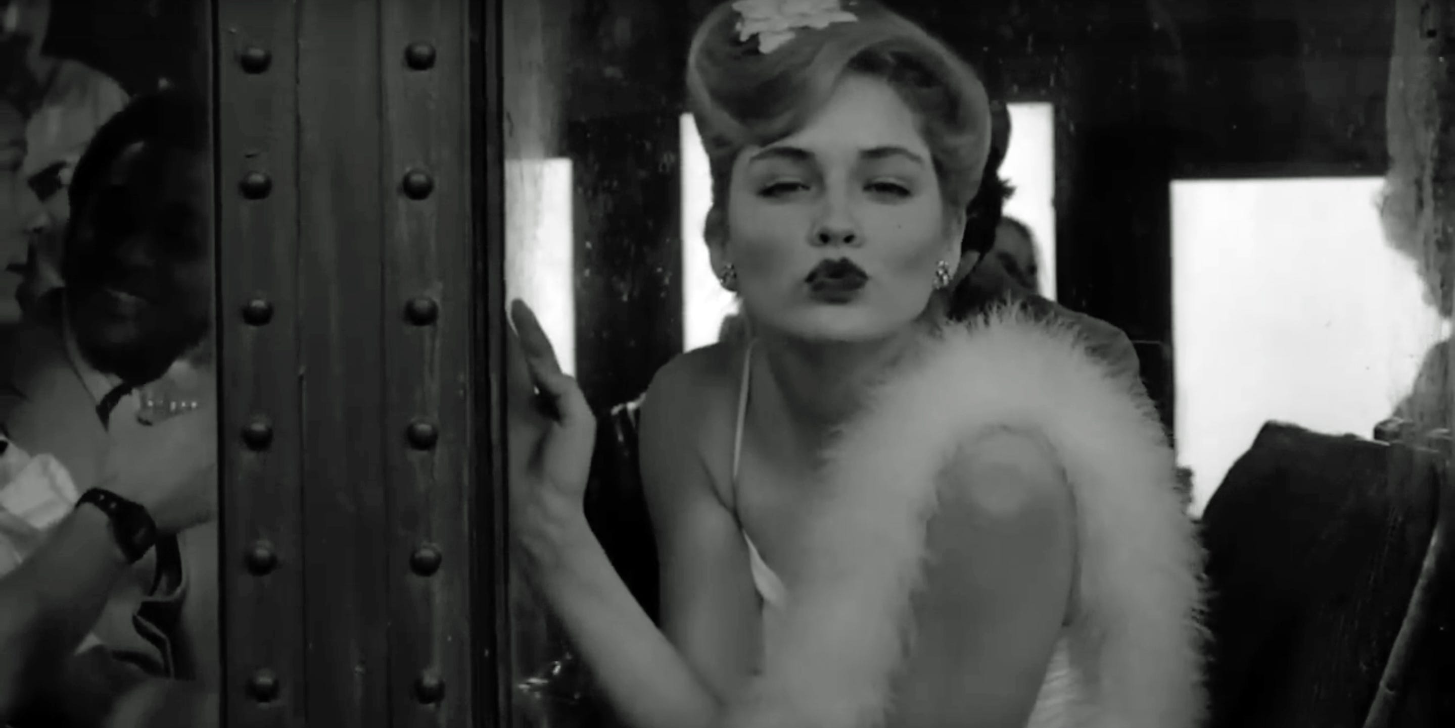Sharon Stone with a kiss face on a train