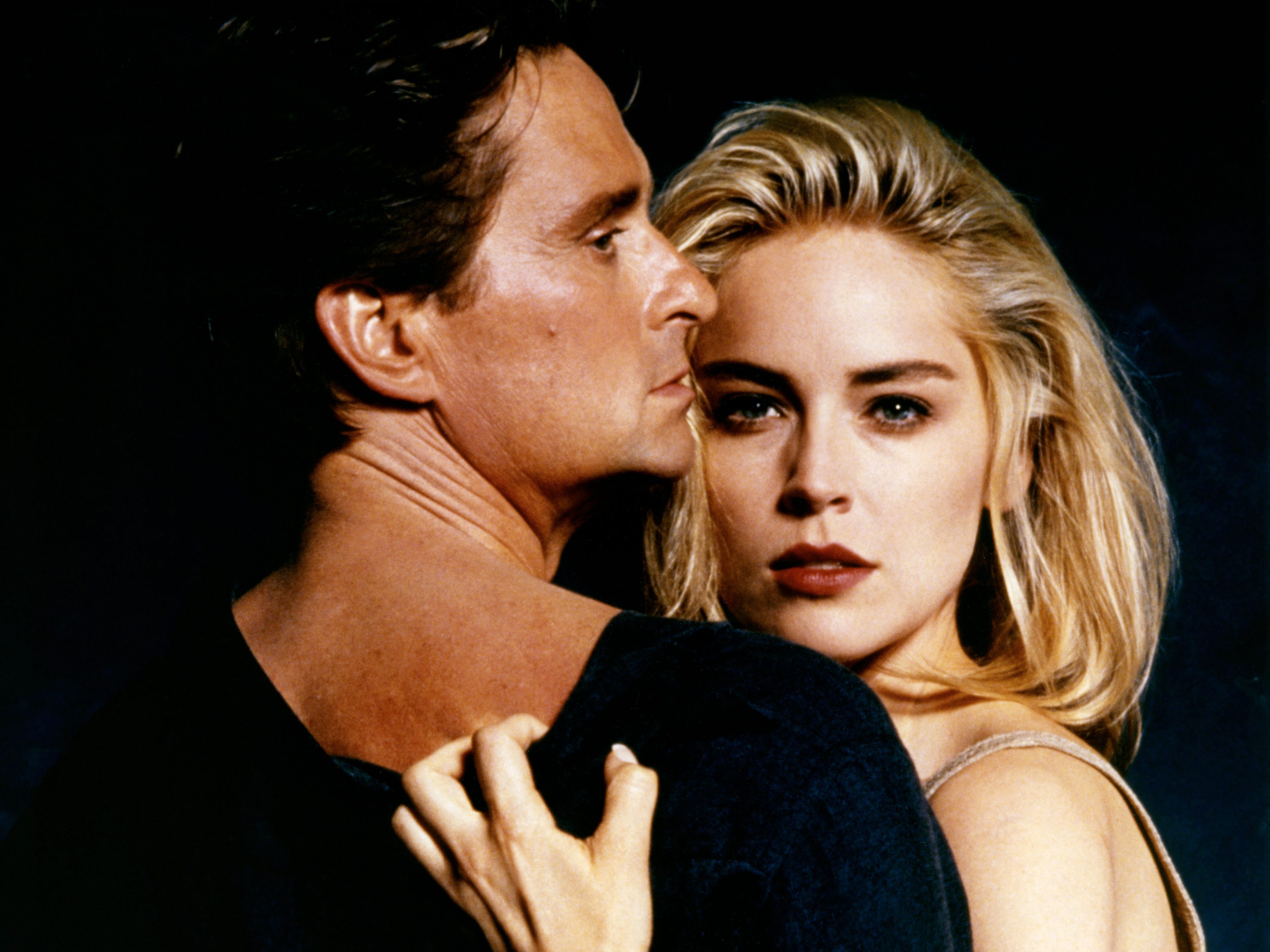 Sharon Stone holding Michael Douglas