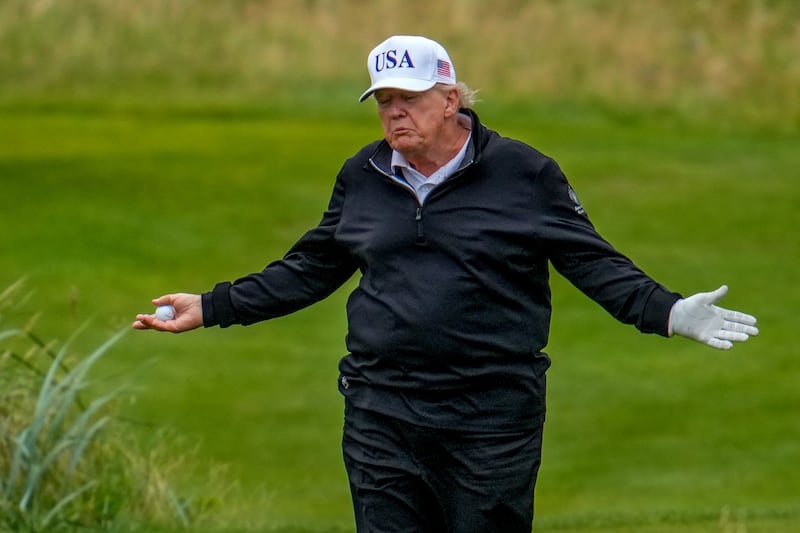 President Donald Trump reacts as he plays a round of golf at Trump Turnberry golf course during his visit to the UK on July 27, 2025 in Turnberry, Scotland.