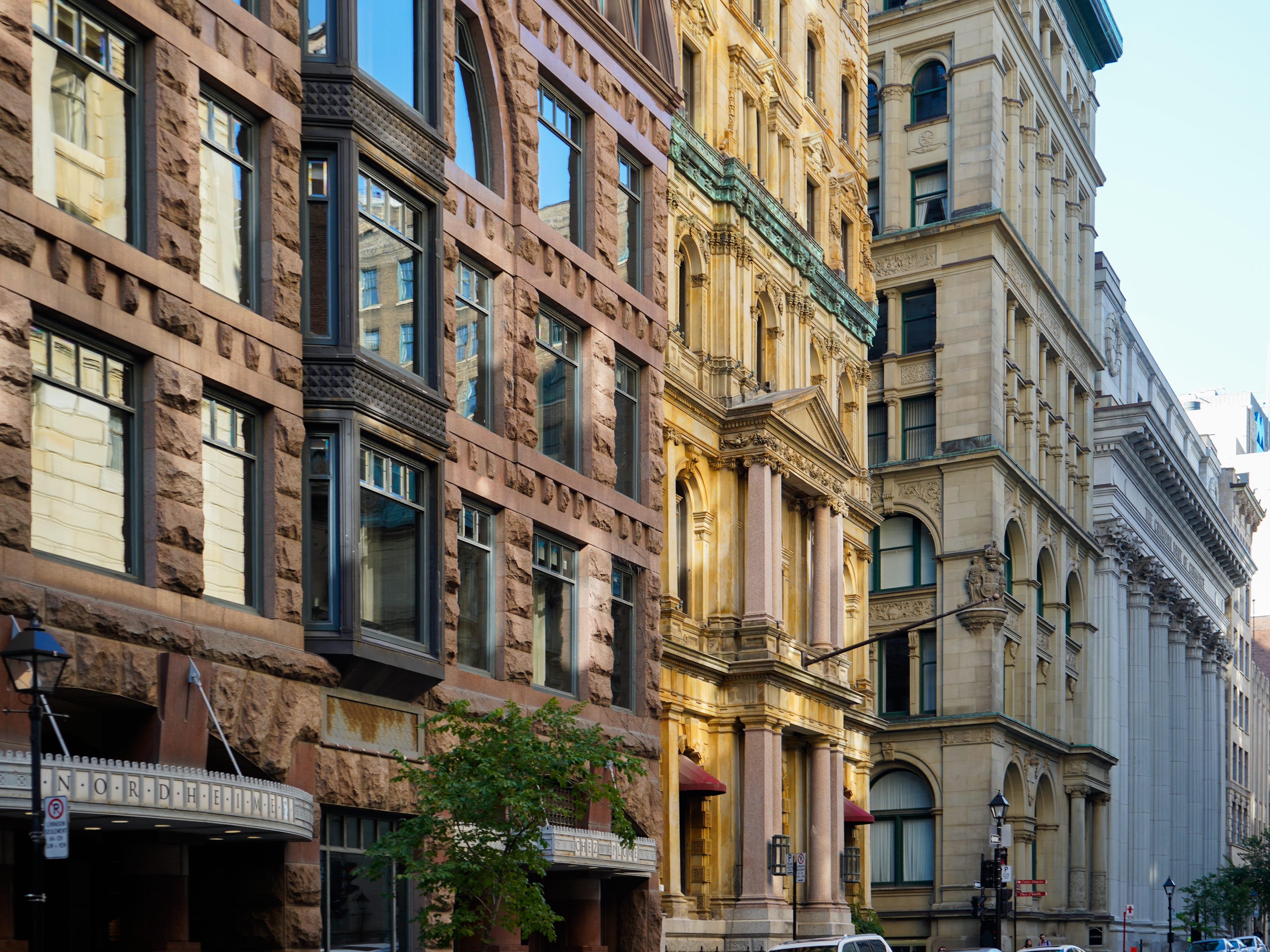 A side view of four buildings showcasing historical architecture in Montreal