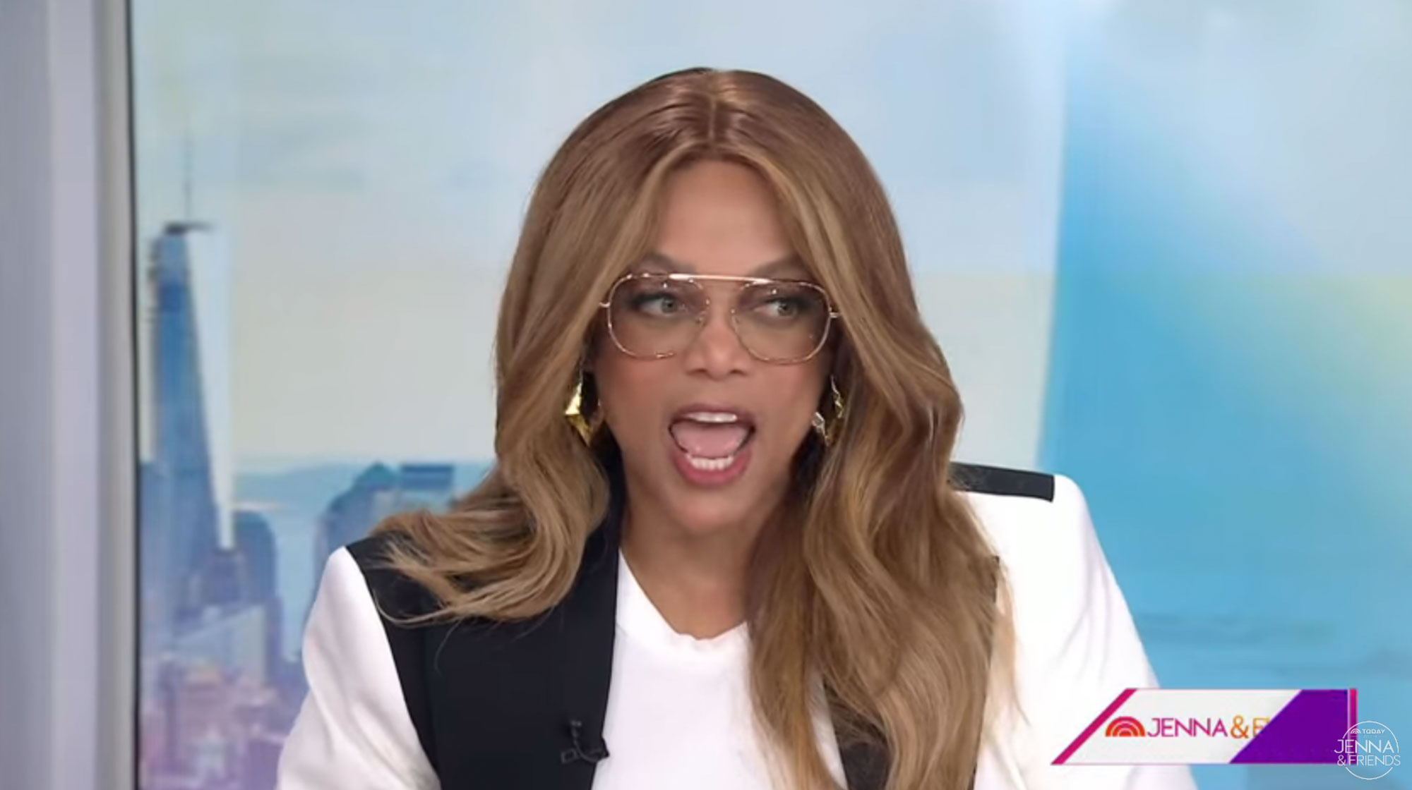 Tyra Banks talking at a table.  