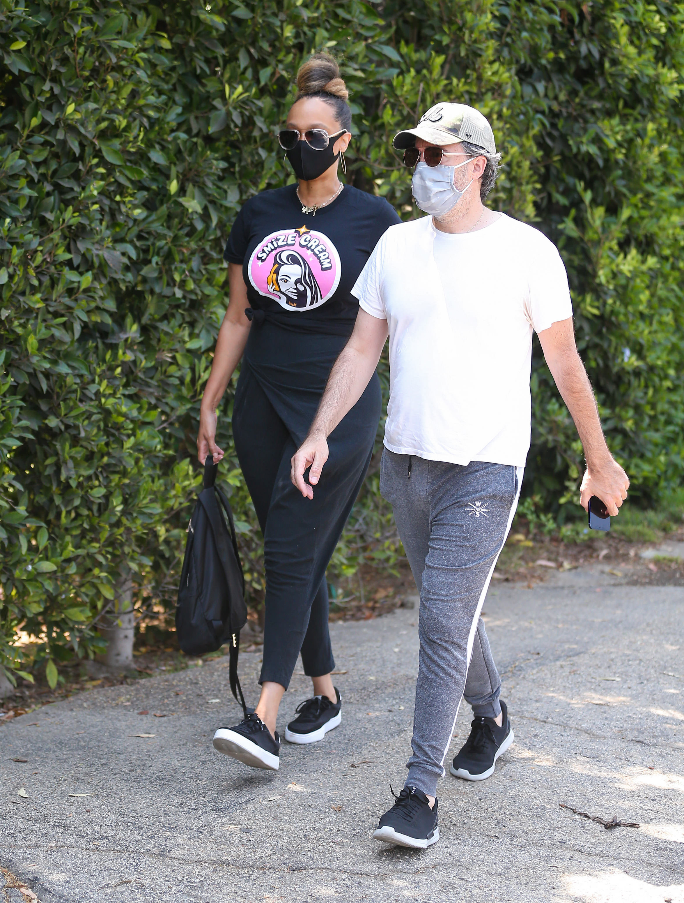 Tyra Banks walks with  Louis Bélanger-Martin. 