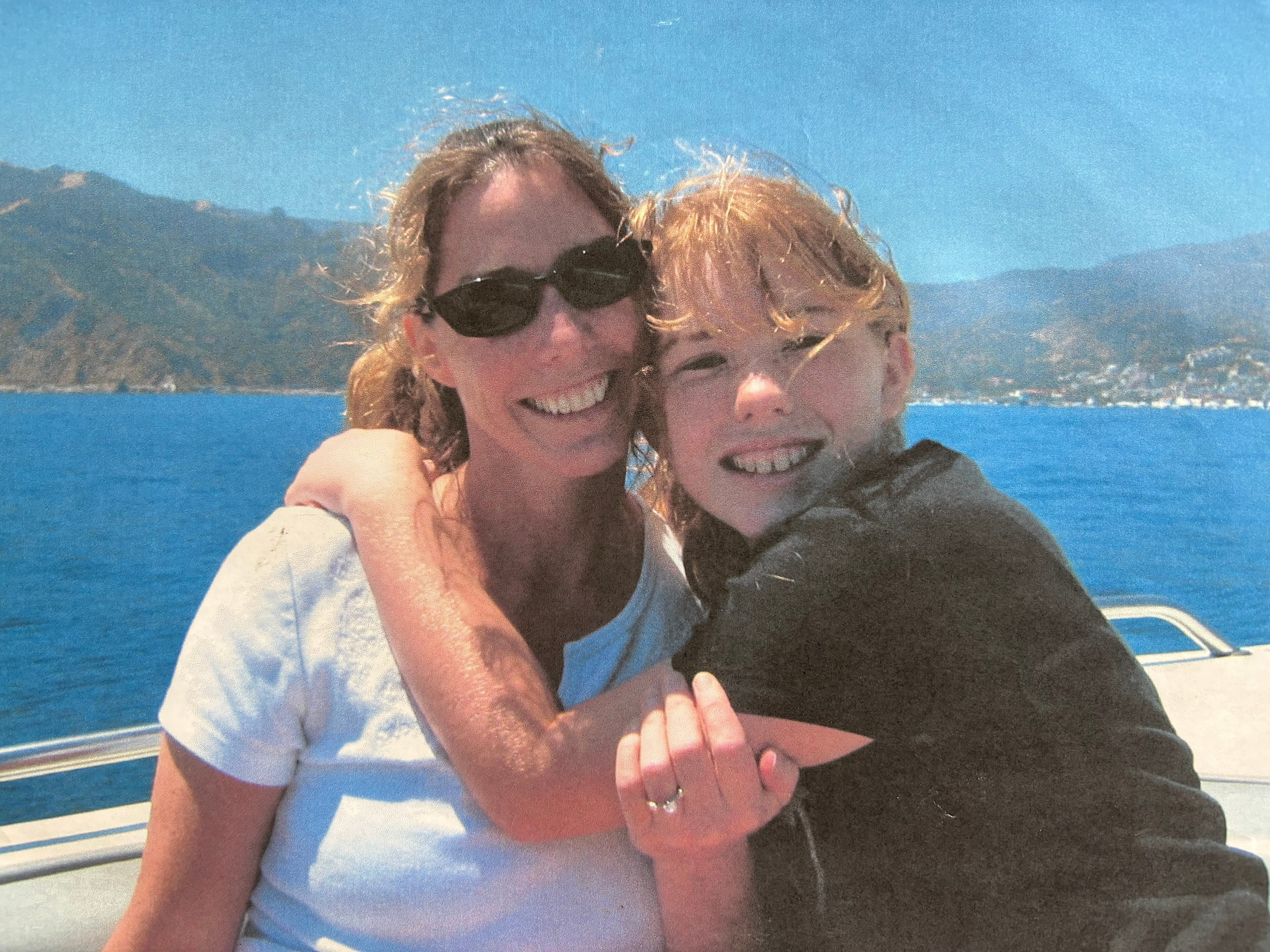 The author and her mom on a boat at Lake Arrowhead.