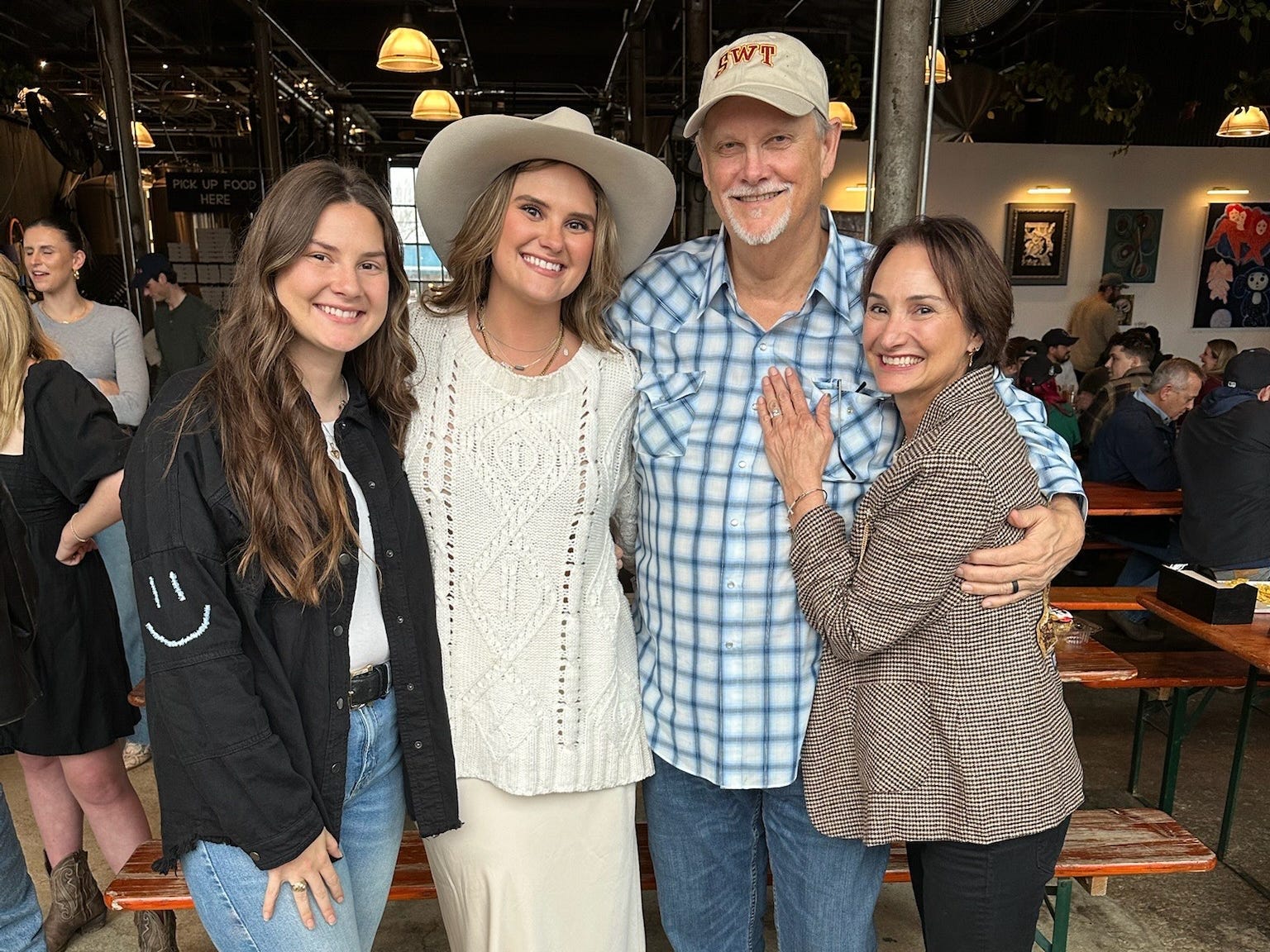 Parrie Hartley and her family smiling.