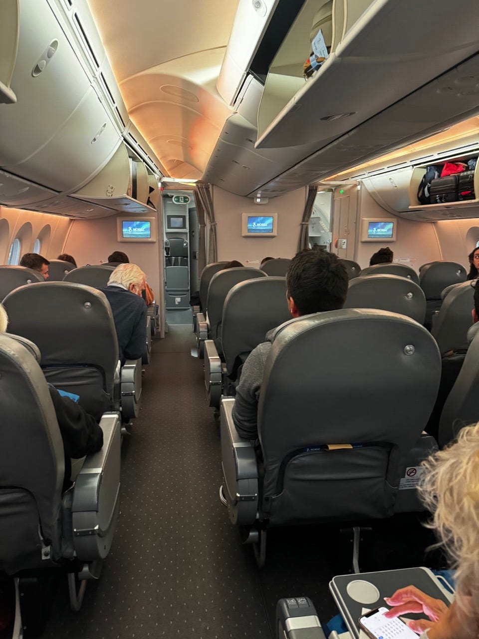 Backs of seats in premium economy on Norse Airways plane