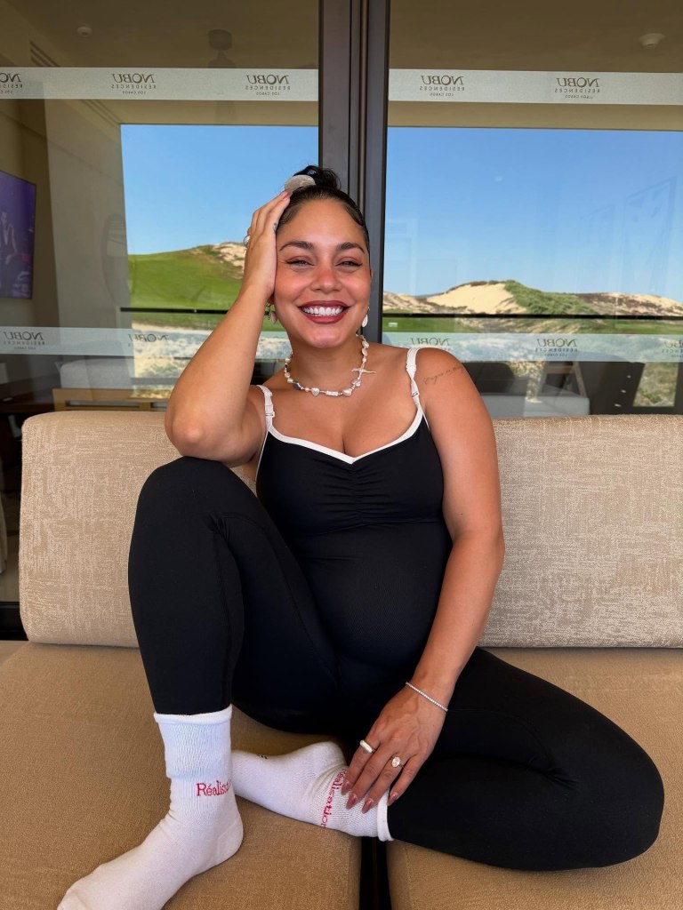 Vanessa Hudgens pauses while on a babymoon while pregnant with her second  child in Cabo San Lucas, Mexico.
