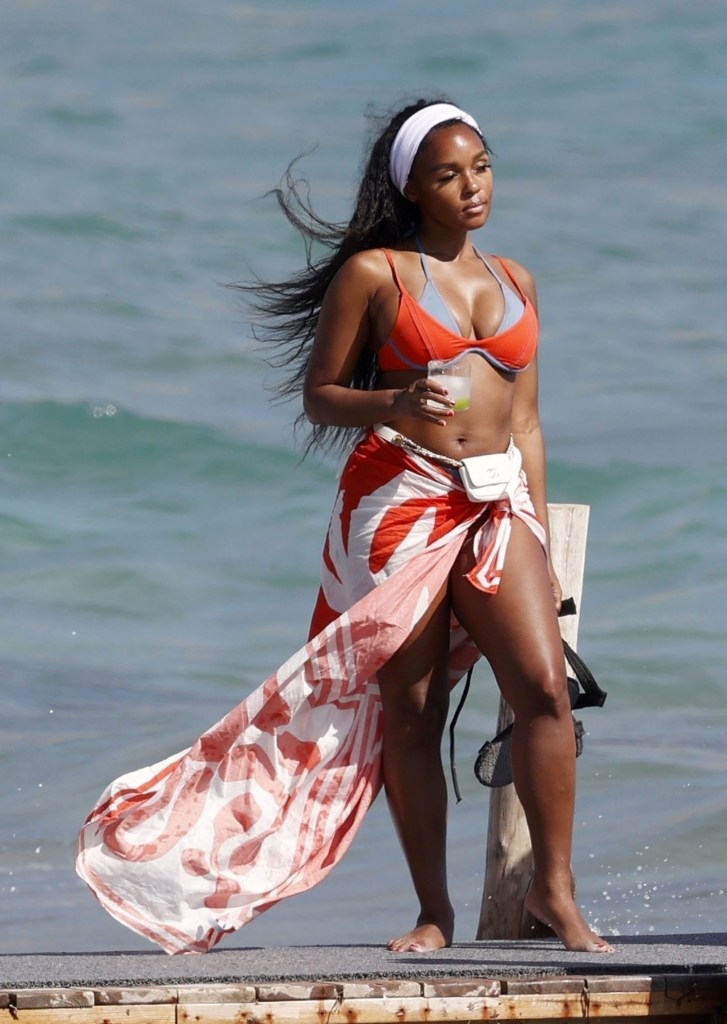 Singer Janelle Monáe enjoys a refreshing beverage while waiting for a boat in Ibiza, Spain.
