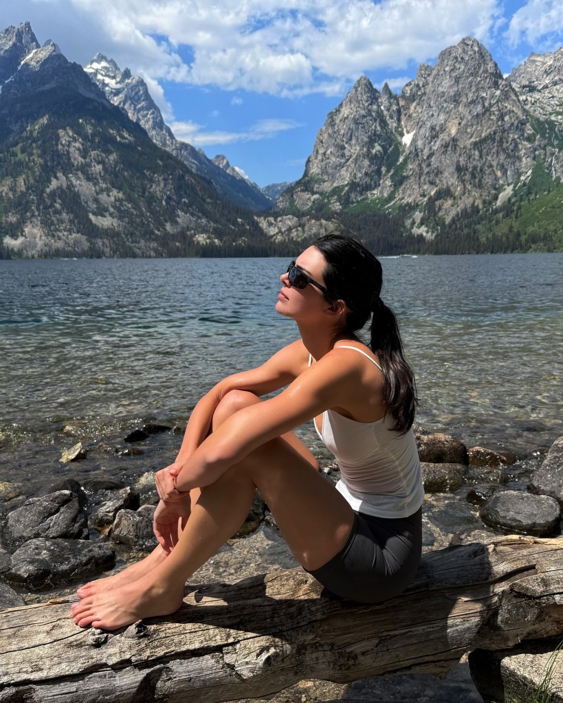 Kendall Jenner takes in the sun, while on a mountain and lakeside photo shoot.
