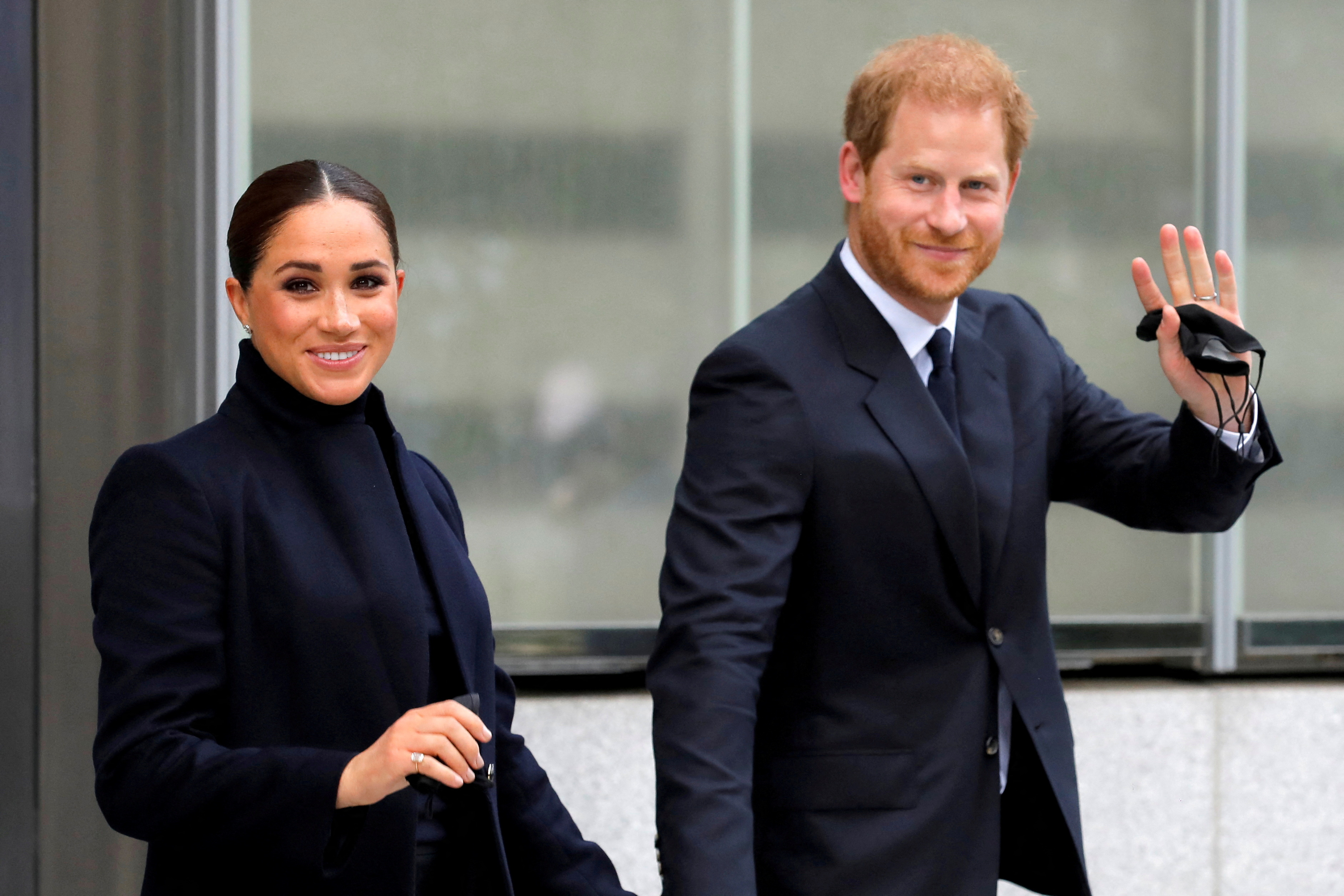 Prince Harry and Meghan Markle smiling. 