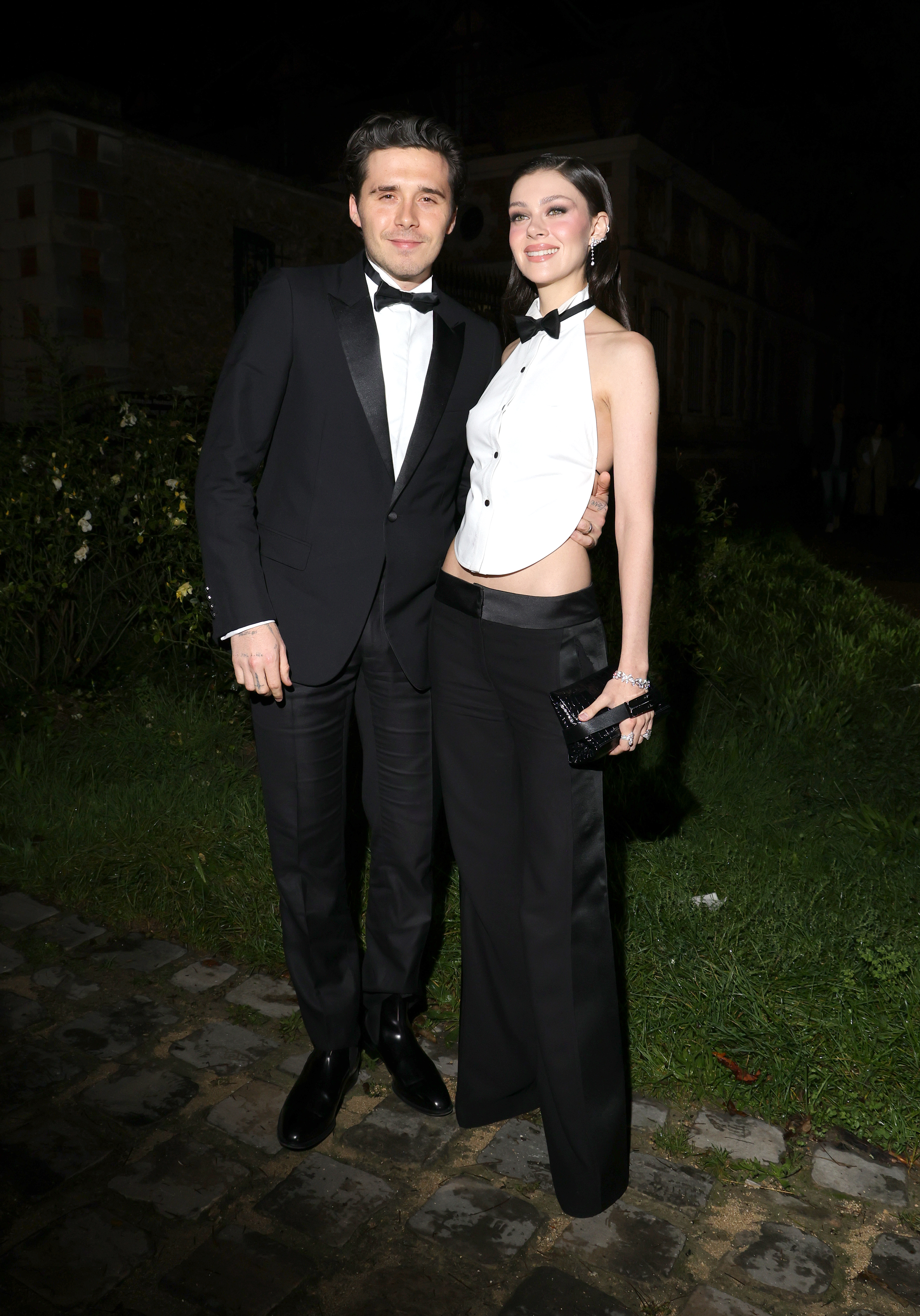 Nicola Peltz and Brooklyn Beckham in tuxedo looks. 