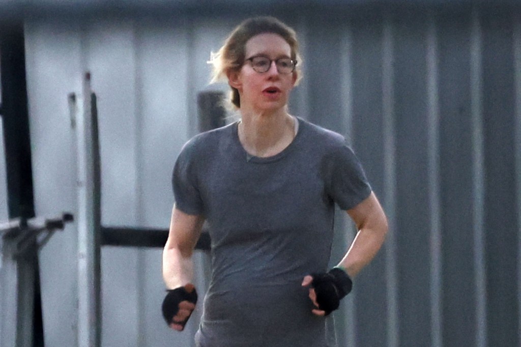 Elizabeth Holmes jogging outdoors.