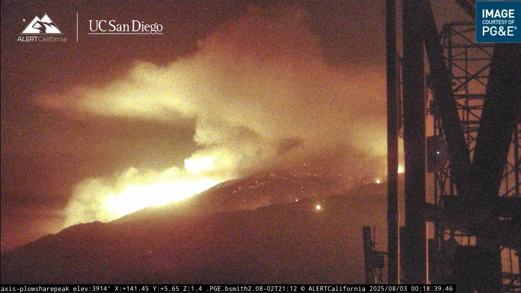 The fire burns along the mountainside on Aug. 3, 2025.