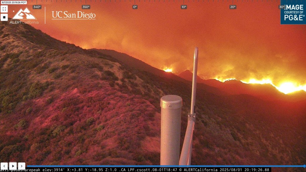 Wildfire at night, viewed from a distance.