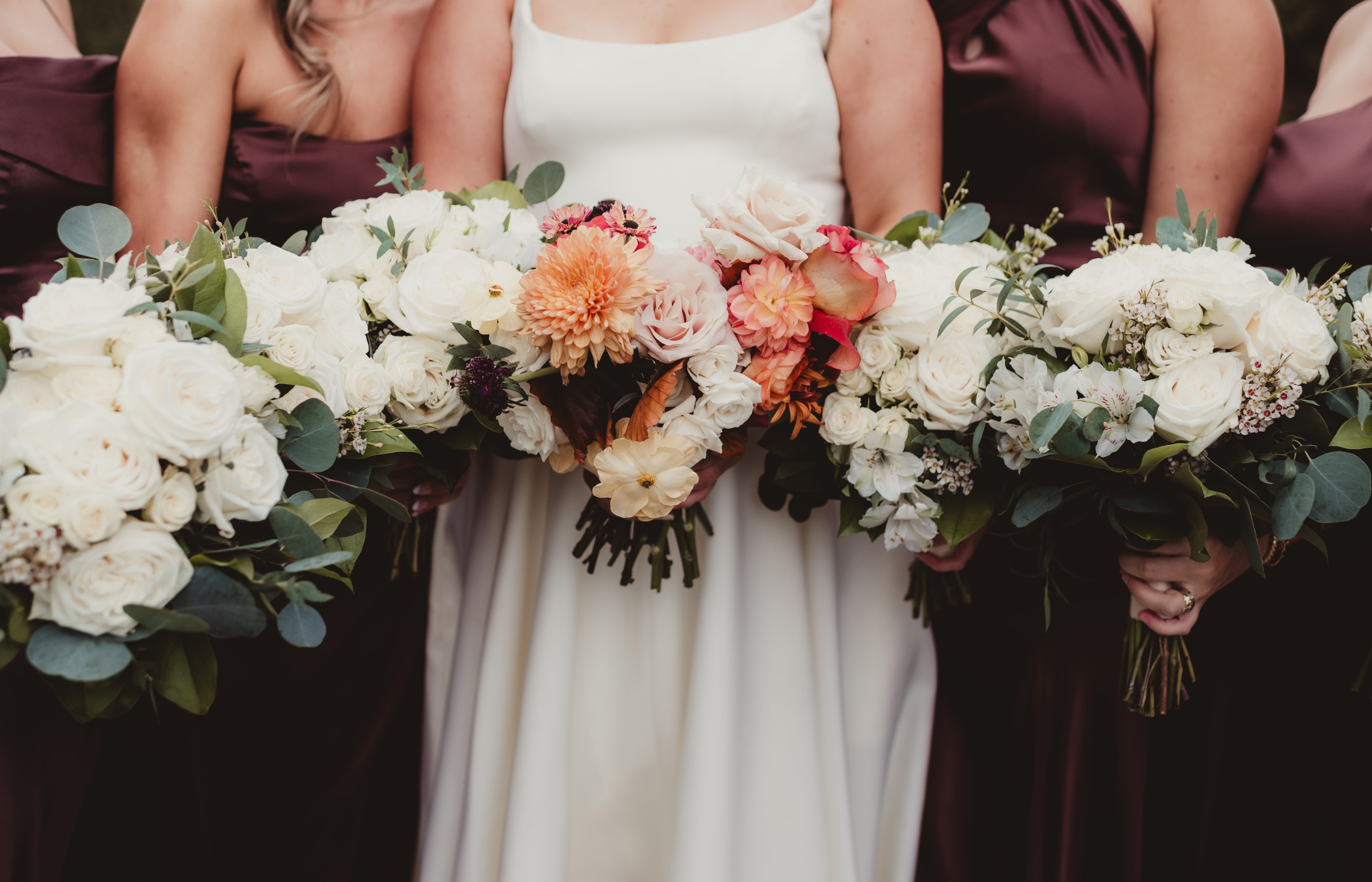 Bride and bridesmaids holding bouqets