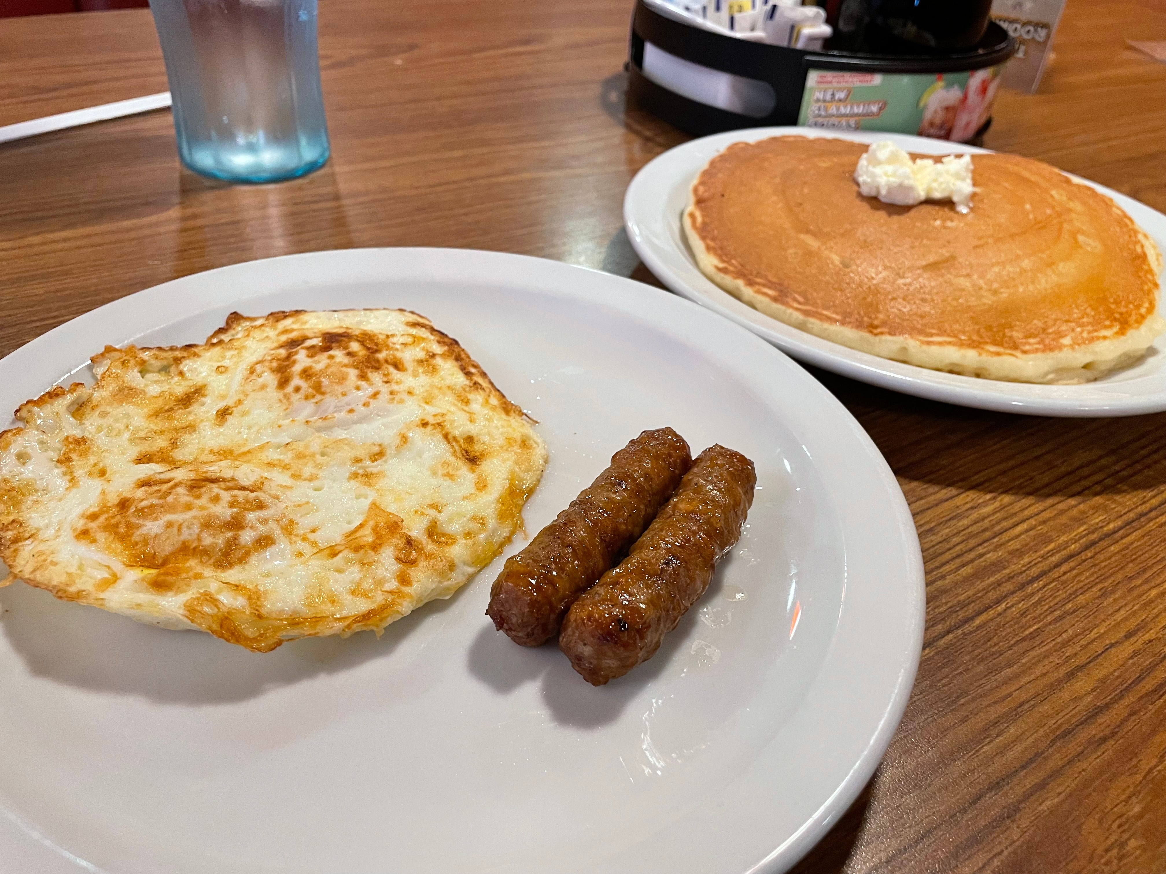 Egg, two sausage links on plate at Denny's