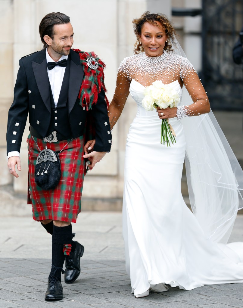 Rory McPhee and Mel B depart following their wedding in the OBE (Order of the British Empire) Chapel at St Paul's Cathedral