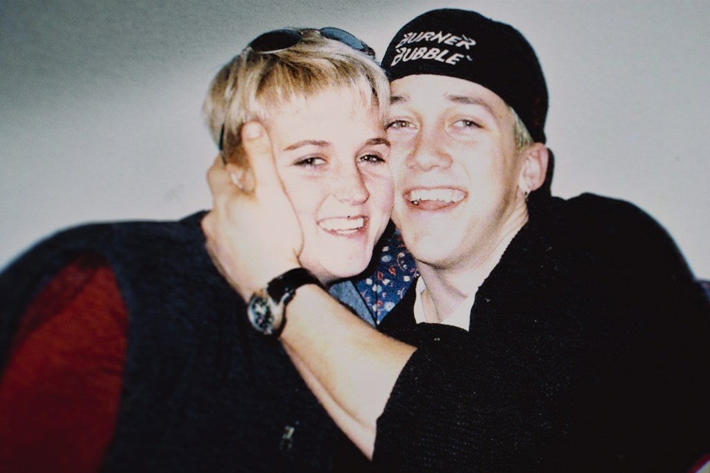 Photo of a young couple embracing.