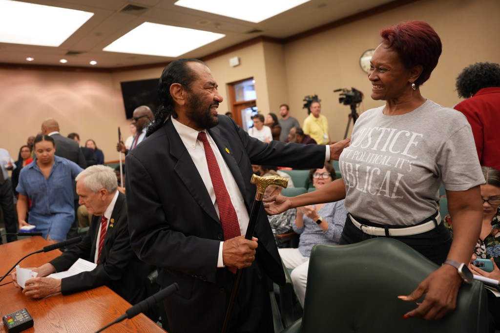 Two men at a Texas congressional redistricting hearing.